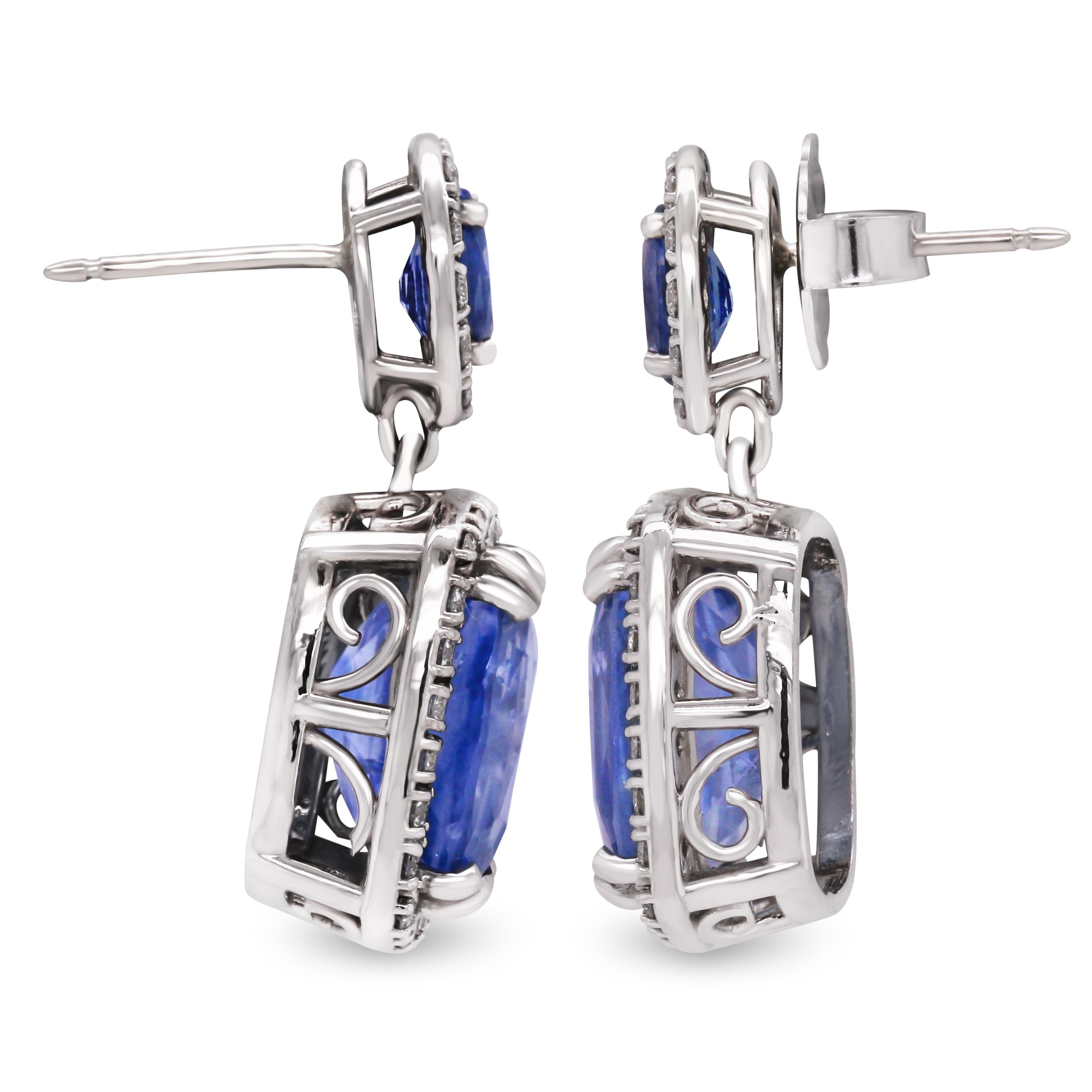 GIA No Heat Cushion Cut Blue Sapphire Diamond White Gold Drop Dangle Earrings

This pair of earrings features two, cushion-cut, matching, natural, no-heat, Sri Lanka Sapphires that are certified by GIA. Measurements are just about the same however