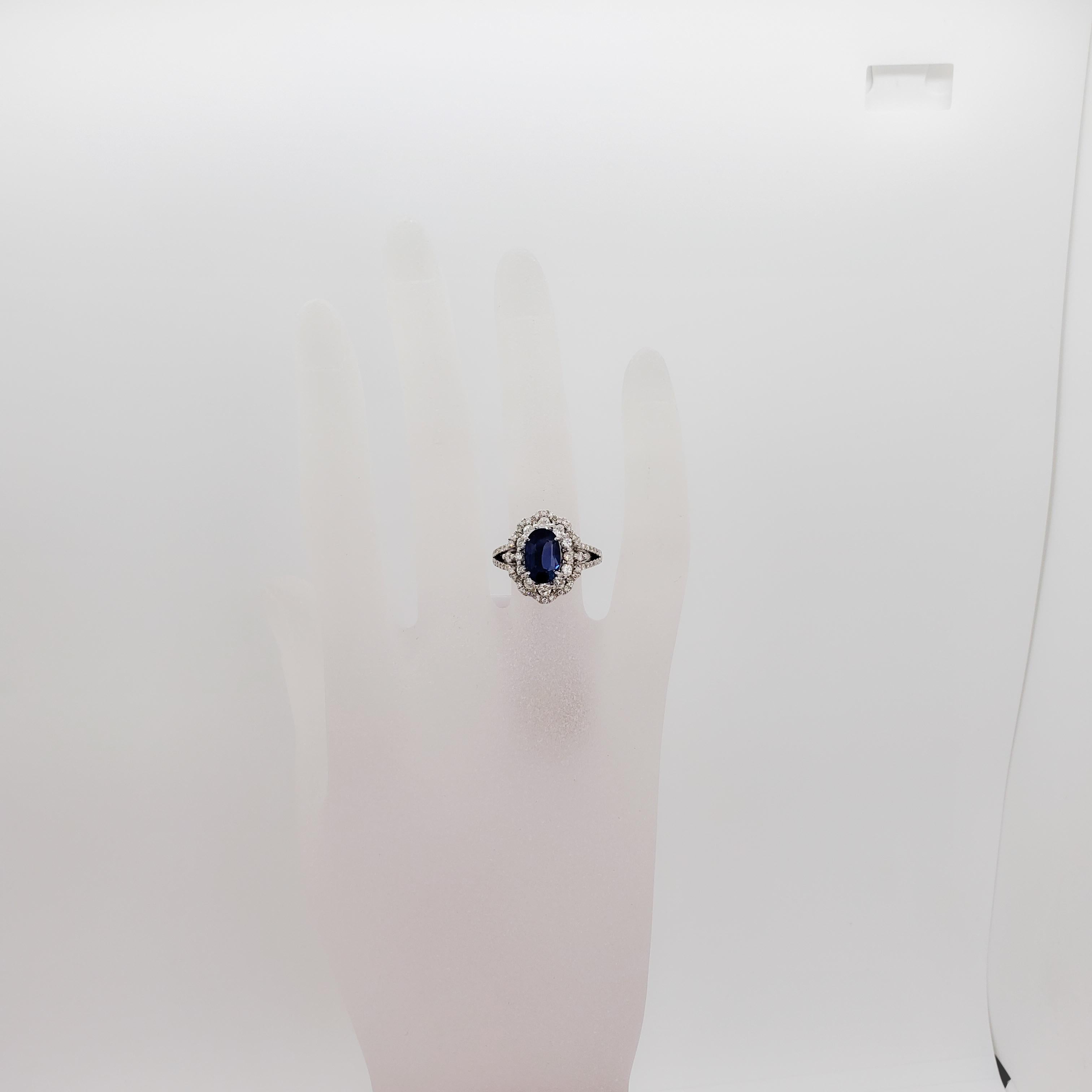 Absolutely stunning no heat fine quality 2.160 ct. Sri Lanka blue sapphire with a deep blue color.  0.77 ct. of good quality white diamond rounds in a platinum mounting that is handmade.  Ring size is 6.25.  Comes with GIA certificate.