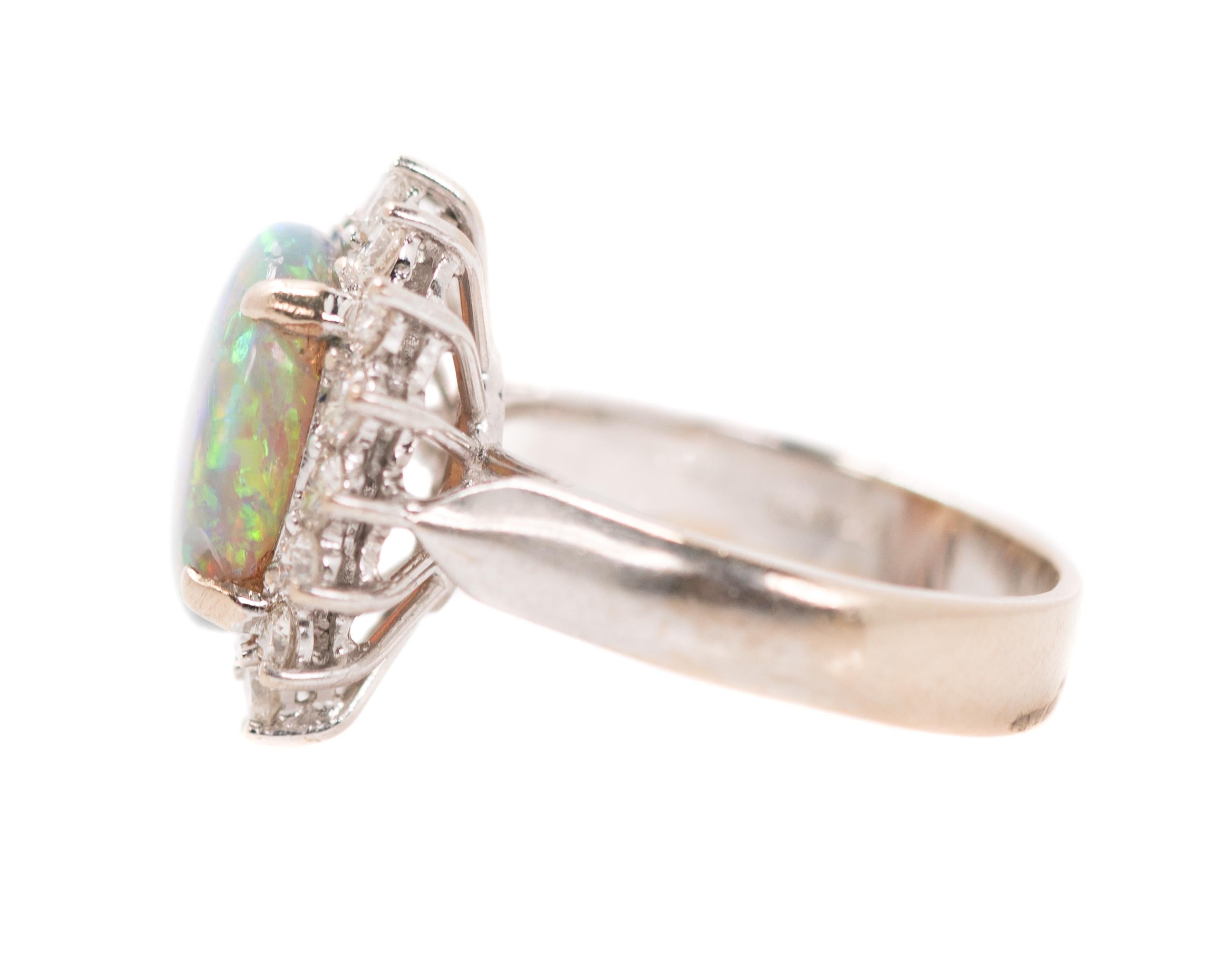 Oval Cut GIA Opal Oval Cabochon and Diamond Halo 18 Karat White Gold Engagement Ring