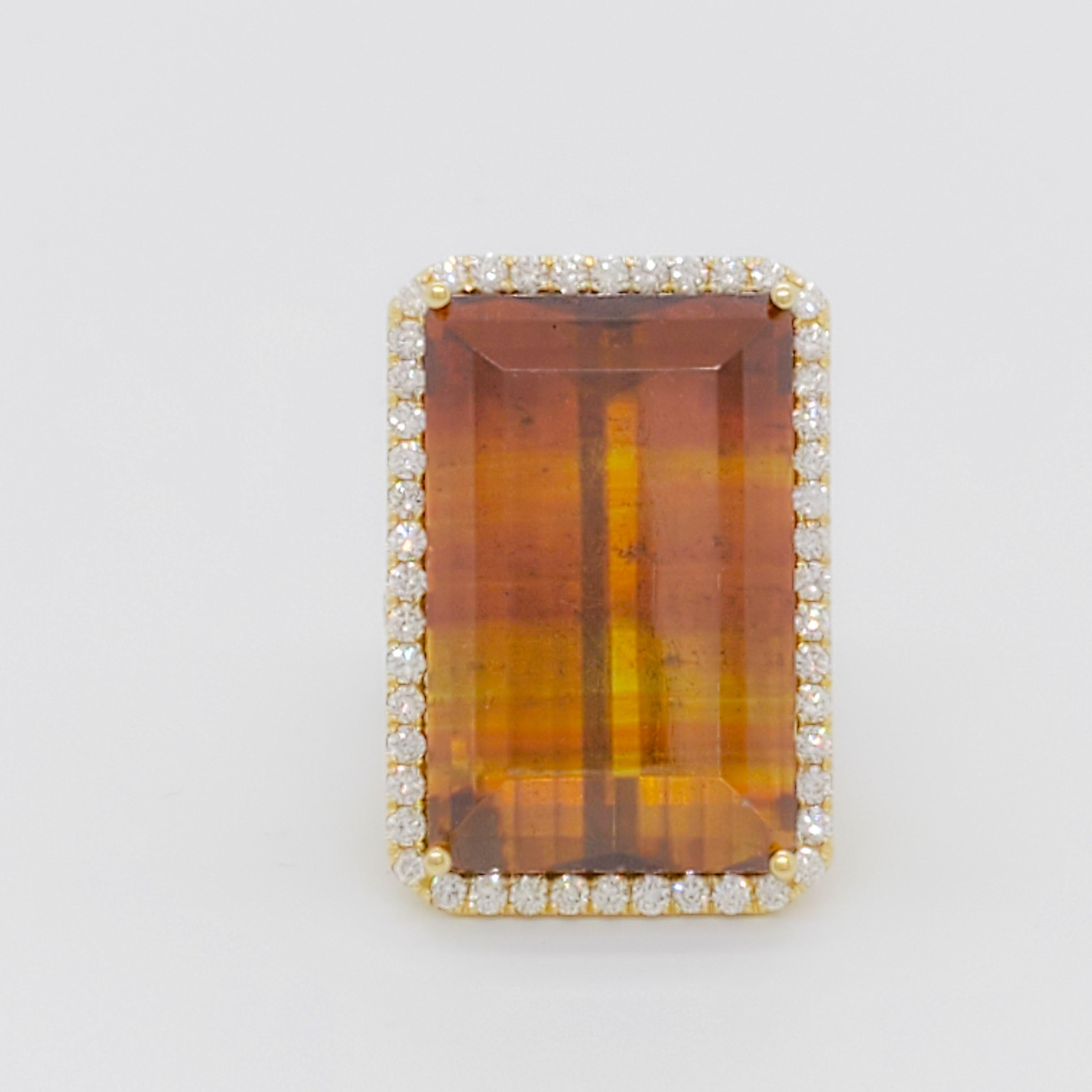 Gorgeous and very unusual 51.17 ct. orange and yellow sphalerite octagon with good quality micro pave round diamonds.  Handmade in 18k yellow gold, ring size 6.5.  GIA certificate included.