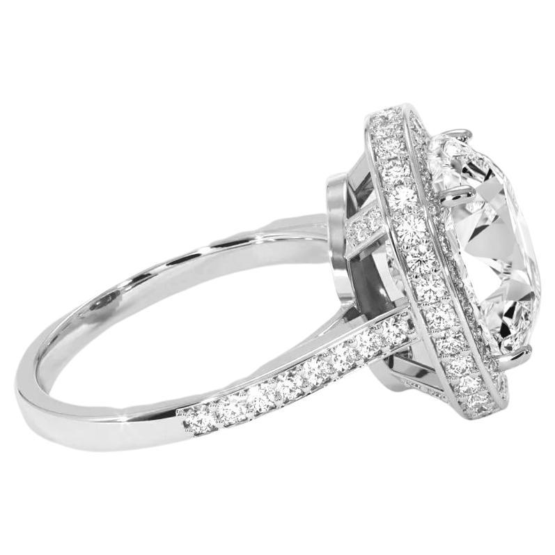 Contemporary GIA Certified 5.03 Oval Cut Diamond Ring with Halo F Color VVS2 Clarity For Sale