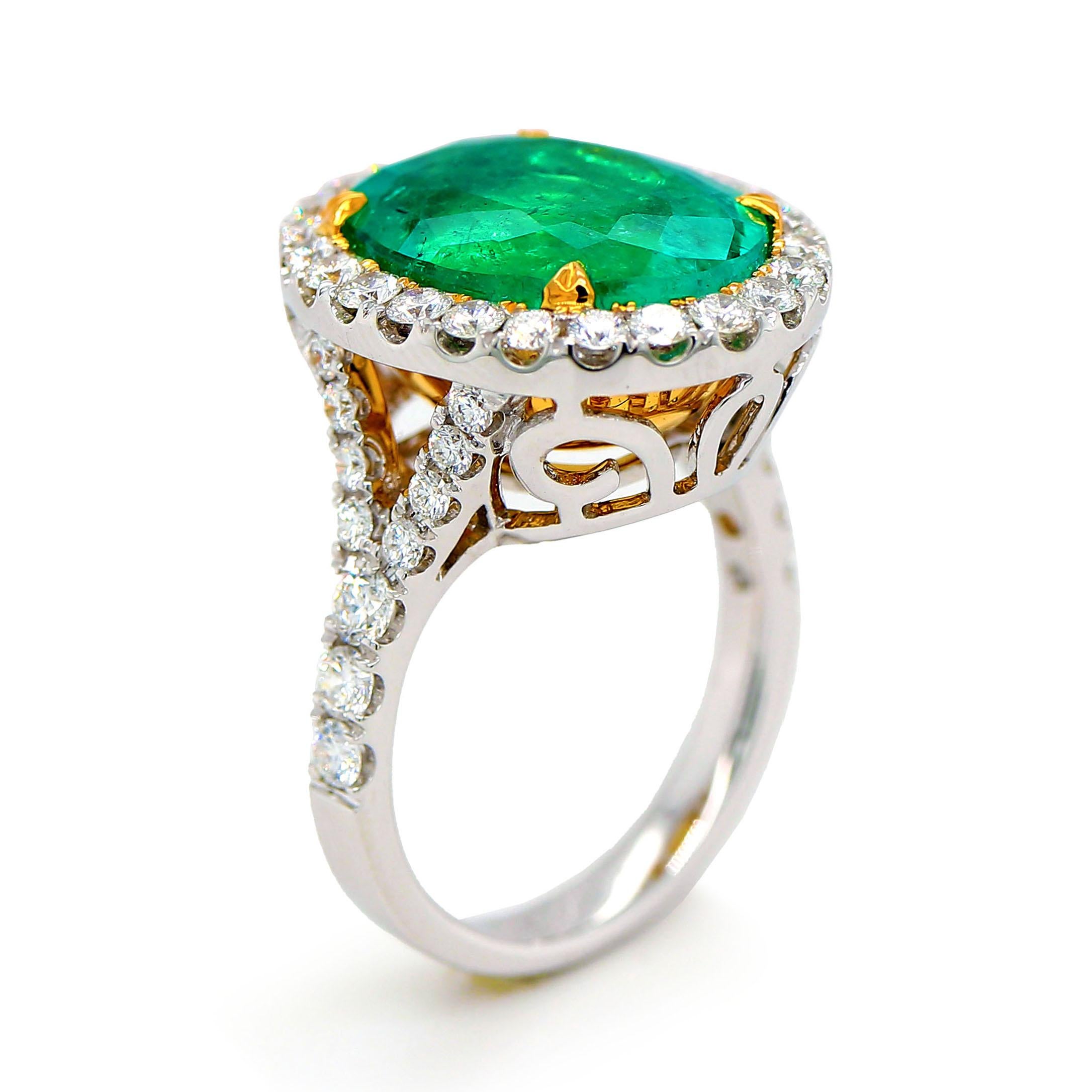 Ring containing one fine Colombian oval shape Emerald of about 8.61 carats measuring 15.05 x 11.98 x 8.17mm. The Emerald is surrounded by 46 round brilliant cut Diamonds of about 1.37 carats with a clarity of VS and color G. All stones are set in