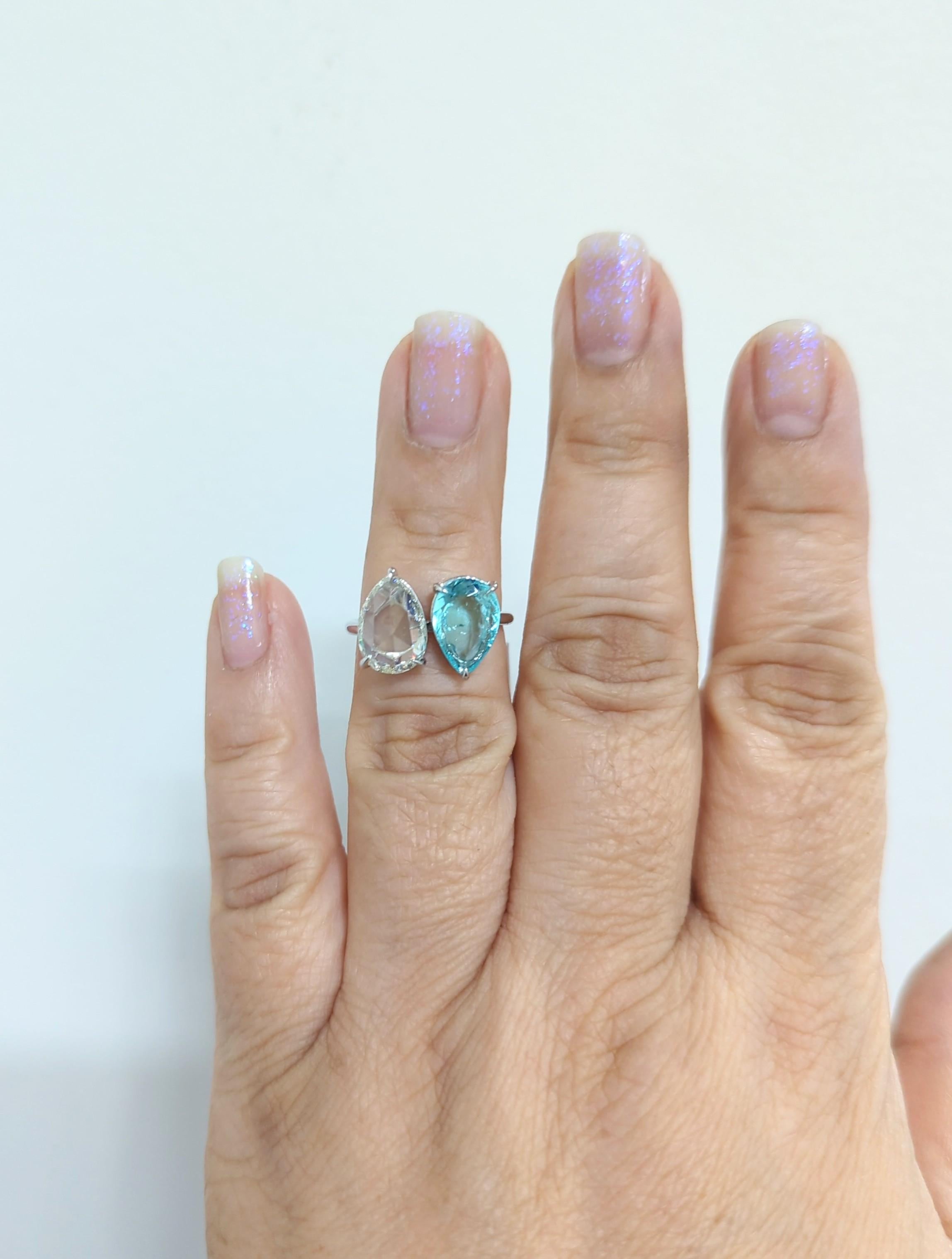 Absolutely stunning ring with a 2.32 ct. paraiba greenish blue tourmaline pear shape with a 2.09 ct. white diamond J SI1 pear shape.  Handmade in platinum.  Ring size 6.5.  GIA certificates included.