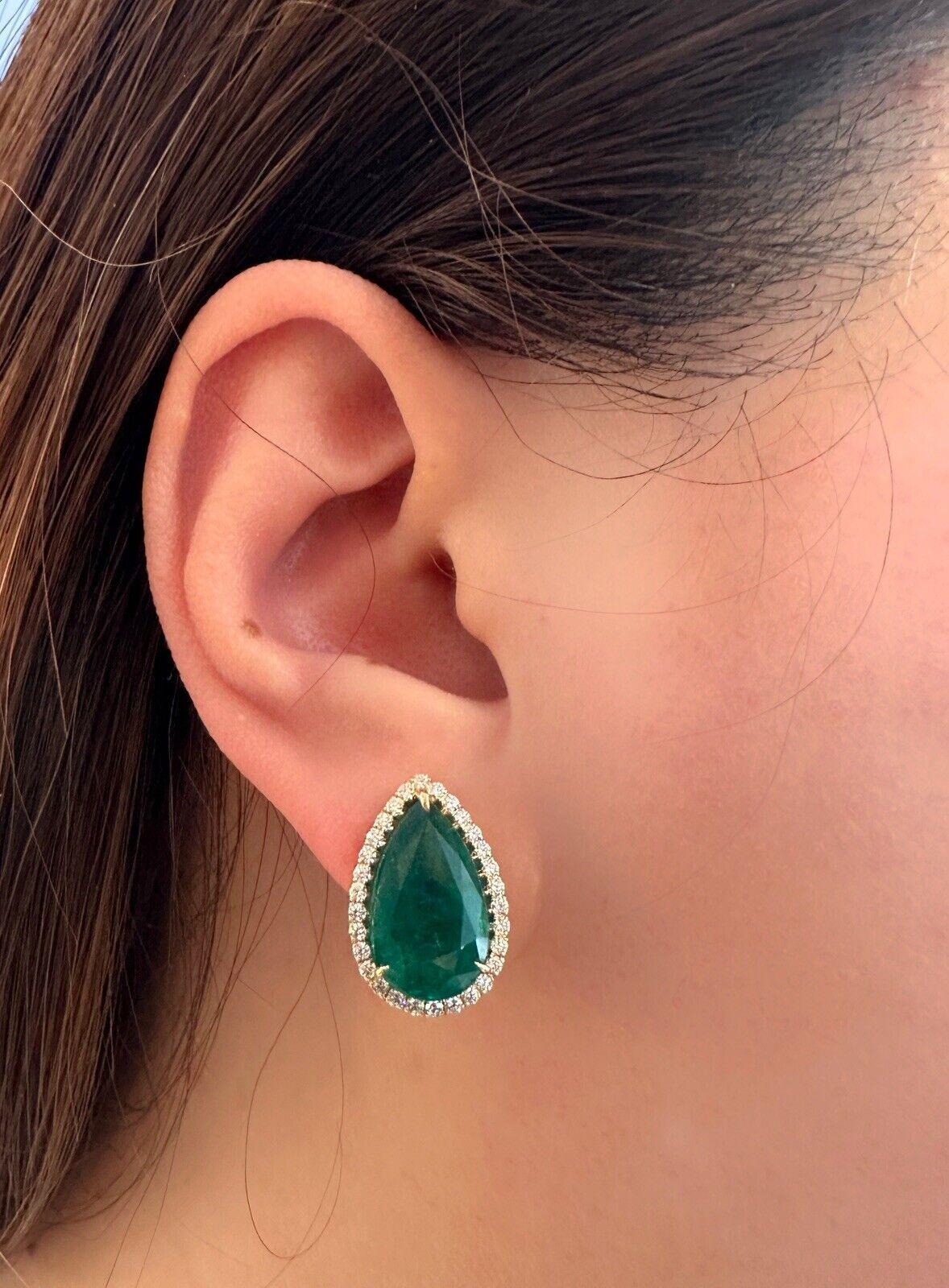 Introducing our captivating GIA Certified Pear Shaped Emerald Halo Diamond Earrings in 18k Yellow Gold. The Zambian Emeralds are elegantly encircled by a halo of Round Brilliant Diamonds.

Features:

Two Natural Pear Shaped Emeralds, total weight