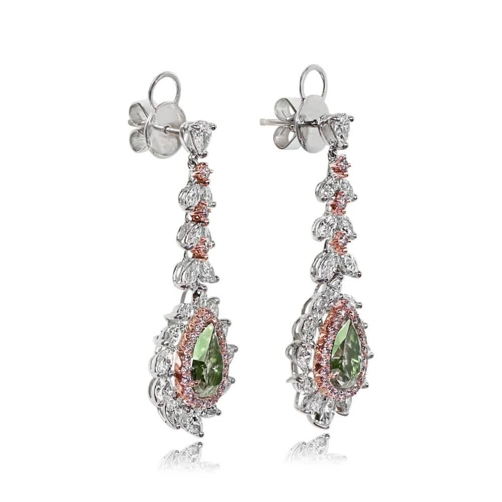 Exquisite fancy diamond drop earrings boasting pear shape Fancy Yellow-Green diamonds (1.49 and 1.34 carats, VS2 clarity), GIA-certified. Adorned with intricate details including halos of round brilliant fancy pink diamonds and a floral design of
