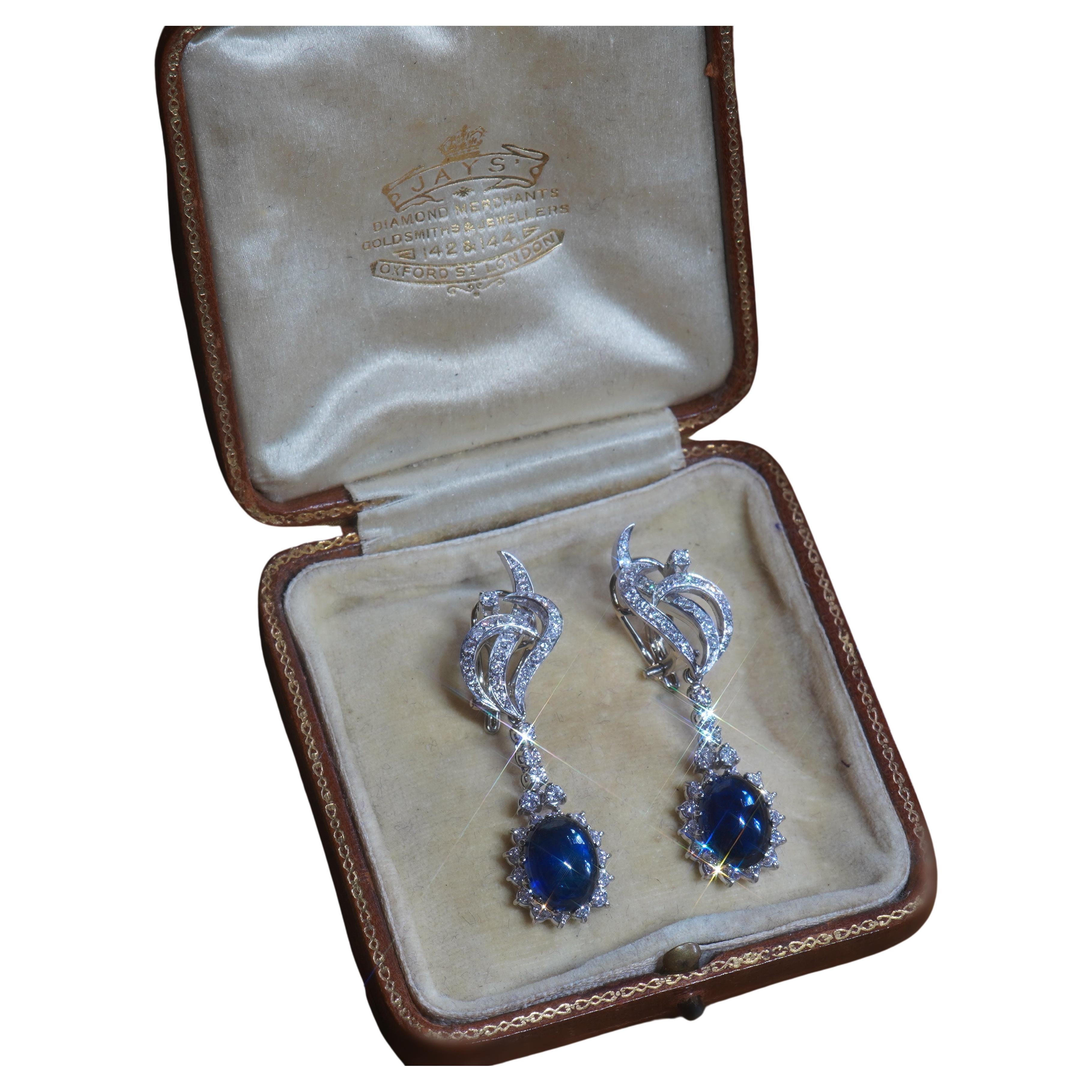 Old South Jewels proudly presents...VINTAGE LUXURY... GIA CERTIFIED PLATINUM 13.92 CARAT UNHEATED STAR SAPPHIRE DIAMOND VINTAGE EARRINGS.   11.74 CARAT TRANSPARENT BLUE GIA CERTIFIED NATURAL SAPPHIRES.  Gorgeous Vintage Sapphires are Crowned With