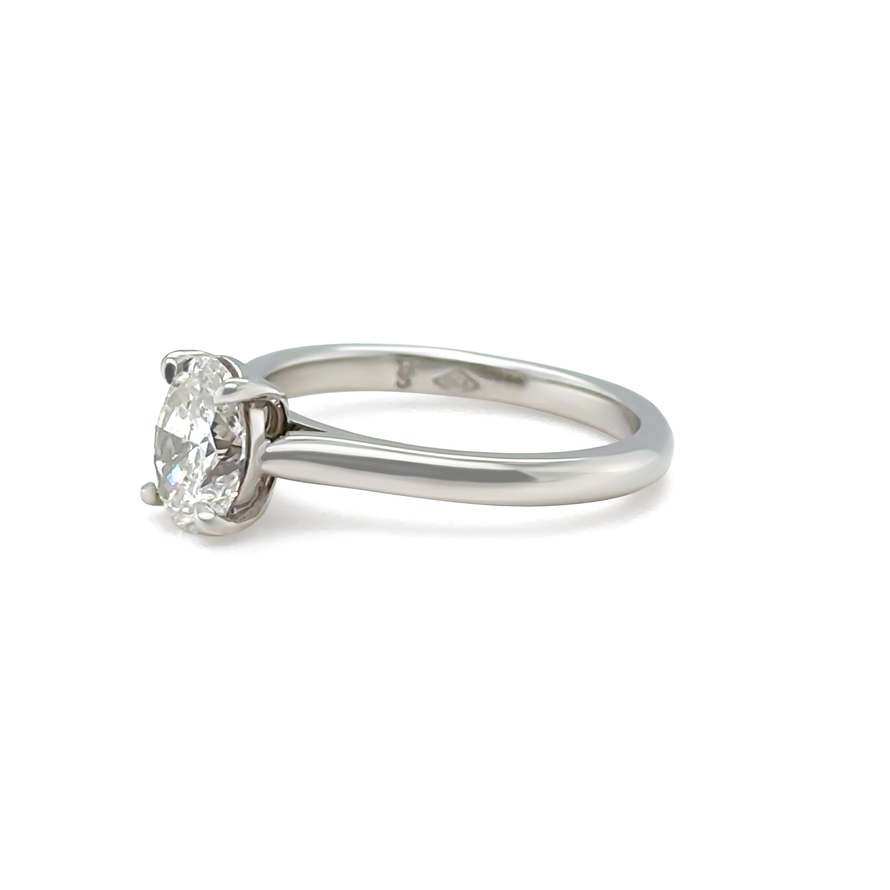 This elegant platinum solitaire ring features a stunning GIA certified 0.80ct oval brilliant-cut diamond, secured in a timeless four-claw setting on a slender 2mm band. The diamond is graded F colour and SI2 clarity, with excellent polish and very