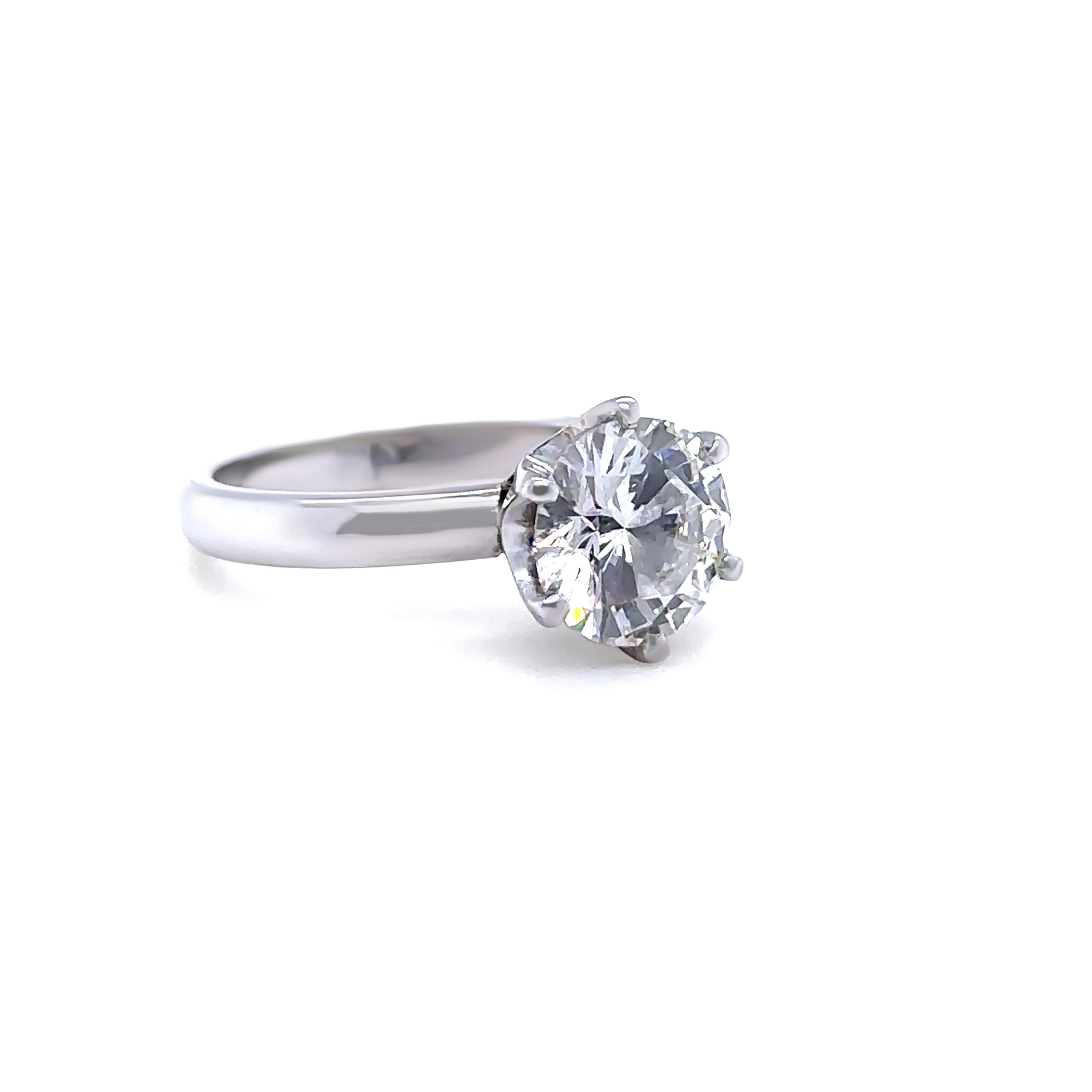 This elegant diamond engagement ring is crafted in premium 950 platinum and features a GIA-certified 1.56ct round brilliant cut diamond. The diamond is graded G colour and VS1 clarity, offering exceptional sparkle and quality in a timeless solitaire