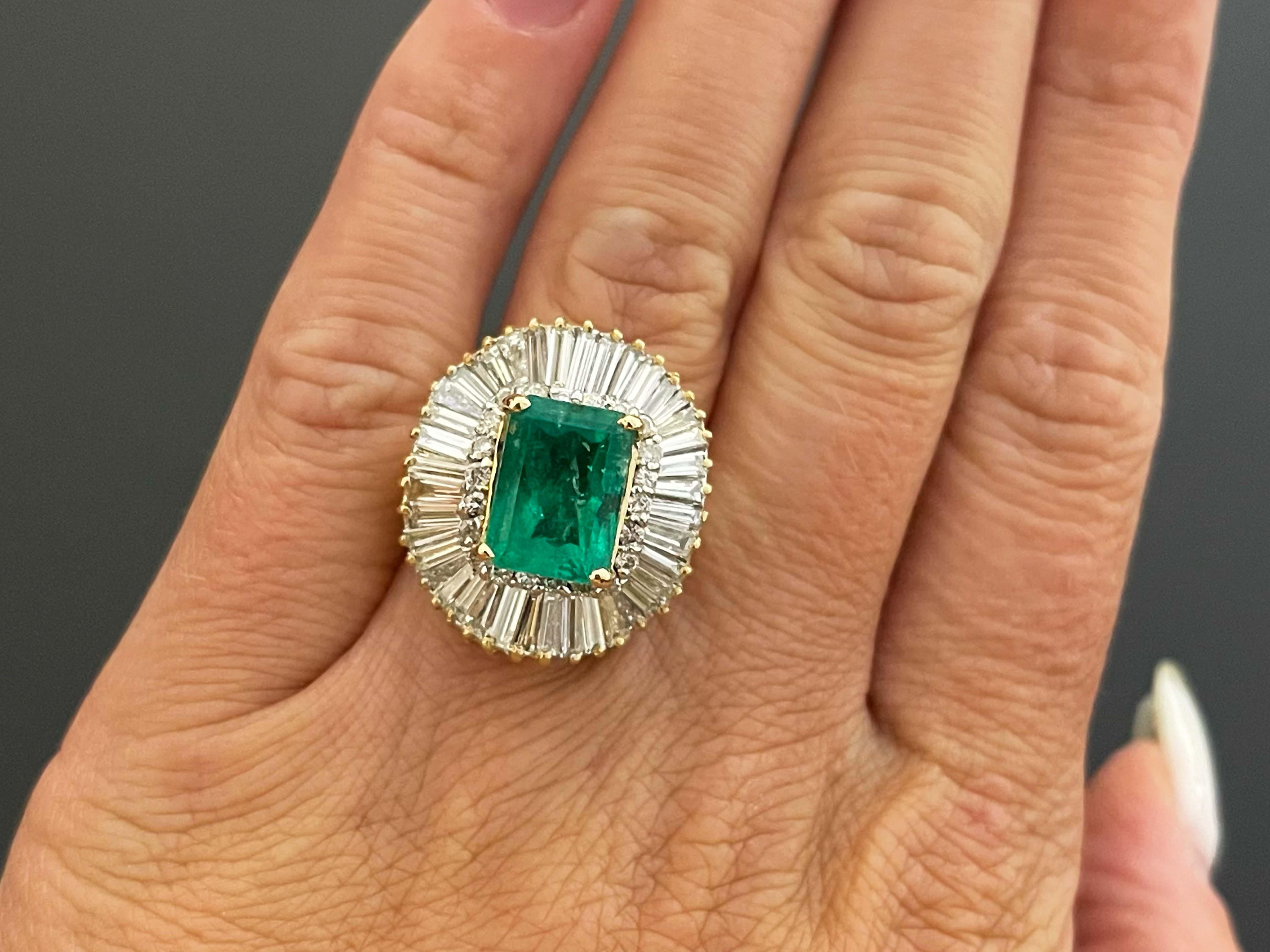 GIA Rare 4 ct. Colombian Emerald & Diamond Ballerina Ring in 18k Yellow Gold. This stunning ring features a 4 carat octagonal, step cut, transparent green Colombian Emerald, surrounded by a gorgeous double diamond halo. The Colombian Emerald is