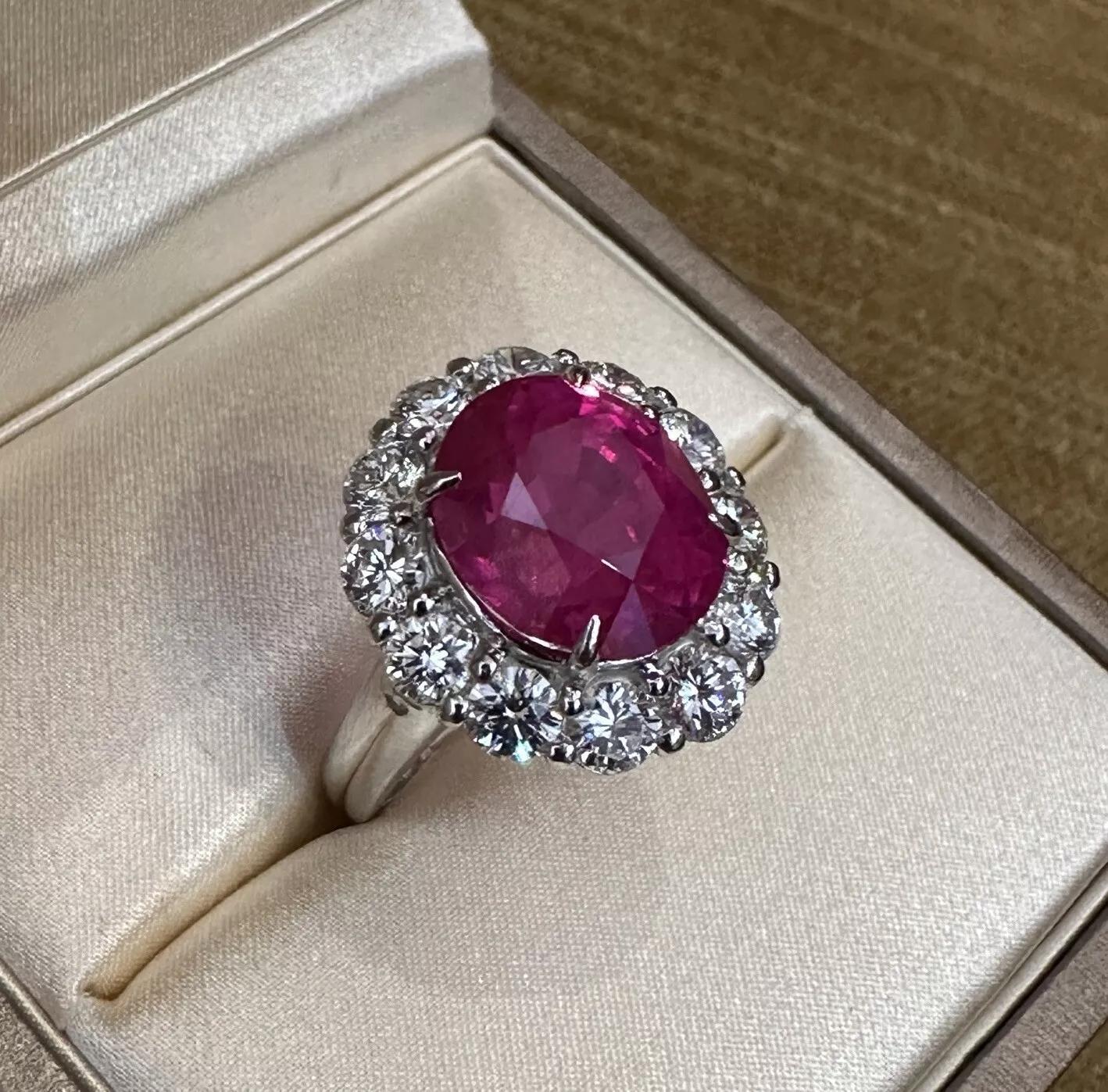 GIA Red Natural Oval Ruby 8.88 carats and Diamond Ring in Platinum 

Natural Ruby and Diamond Rings features an 8.88 carat natural Red Ruby with an Oval faceted cut surrounded by 12 Natural Round Brilliant Diamonds, all set in Platinum.

Total ruby