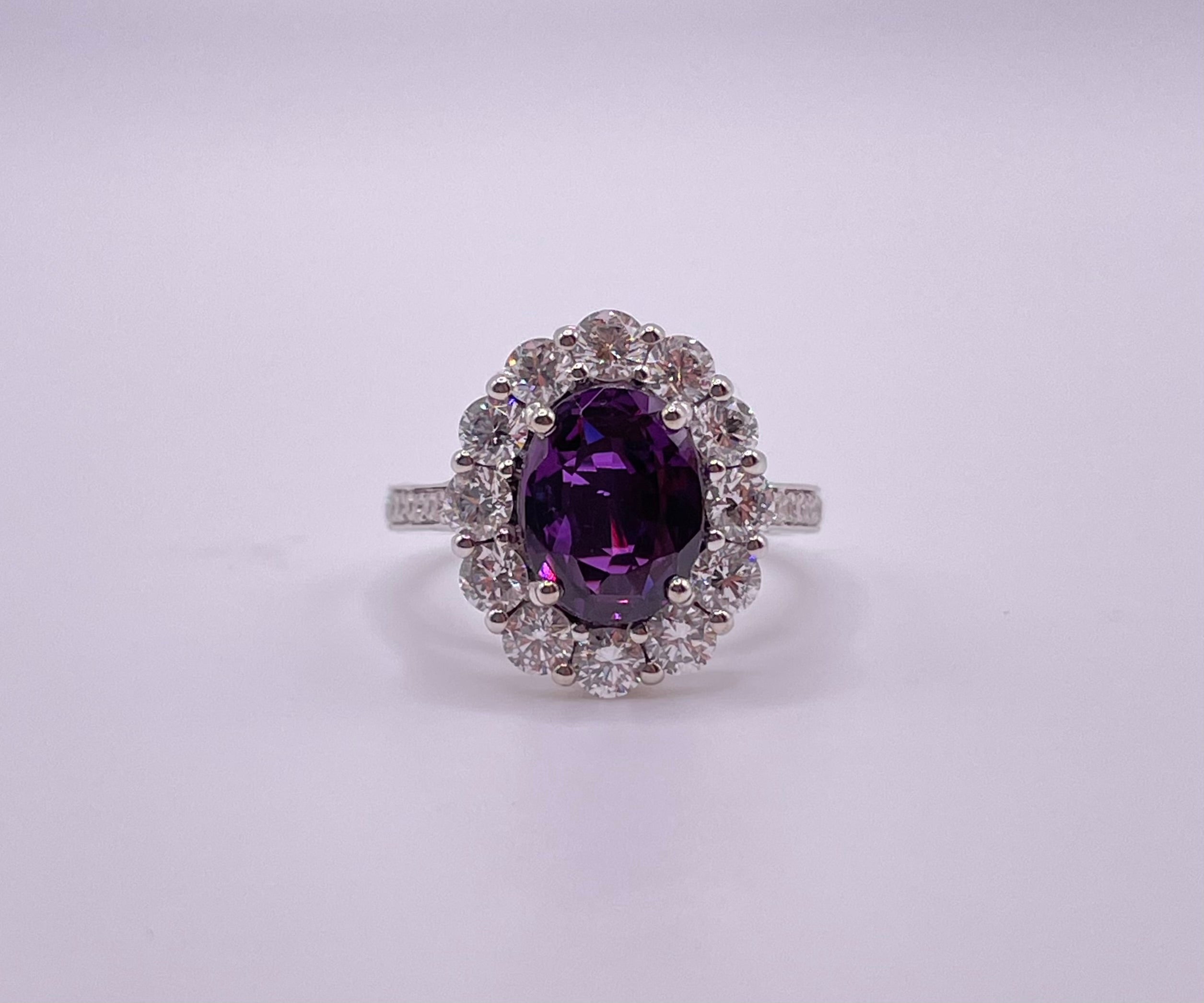 This stunning rare Reddish purple sapphire is set in a handmade 18k white gold diamond setting.
The sapphire is GIA certified.
The beautiful color-tone against the bright, vibrant diamonds makes it stand out and will attract everyone's attention.