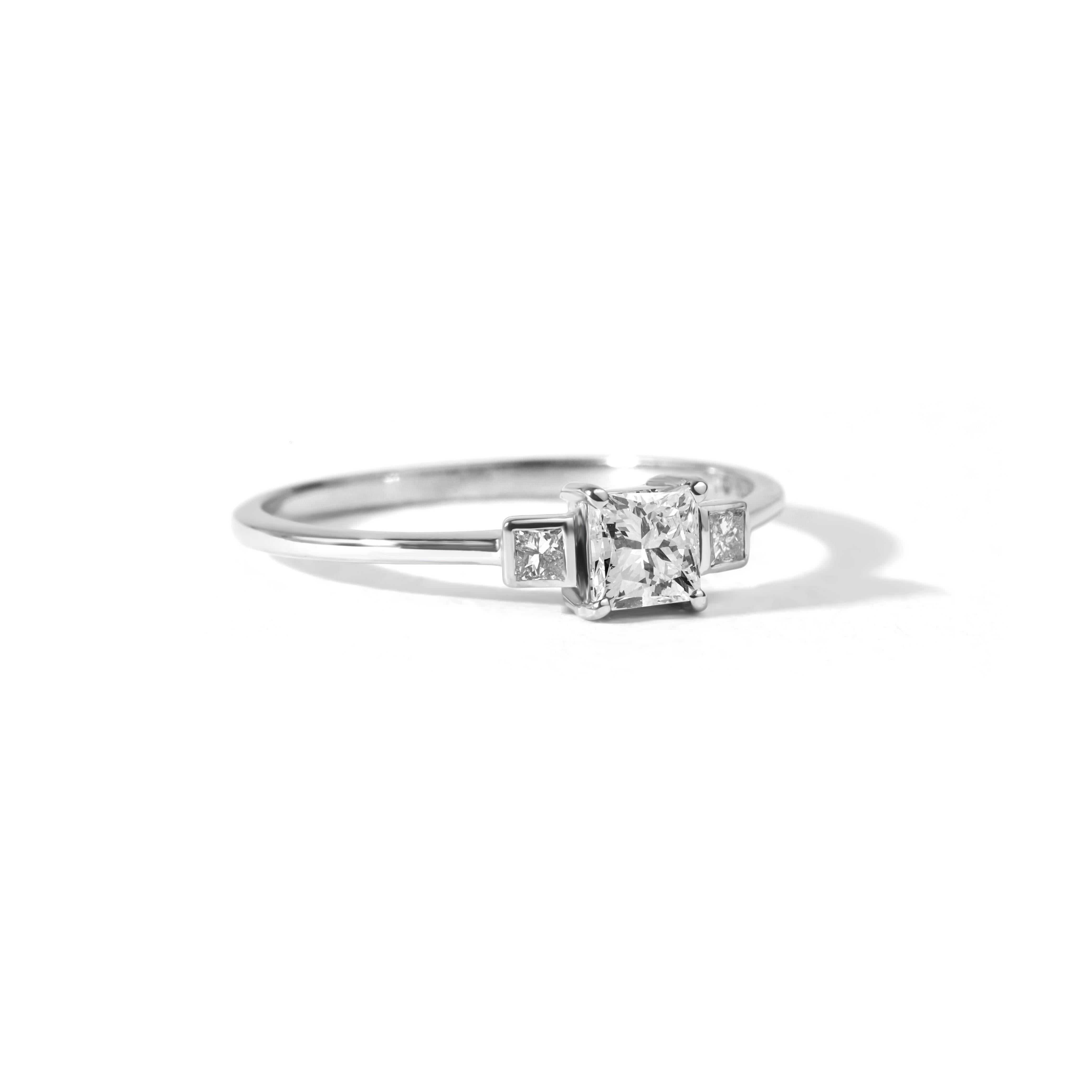 Art Deco GIA Report Certified 0.5 carat Princess Cut Three Stone Diamond Ring White Gold For Sale