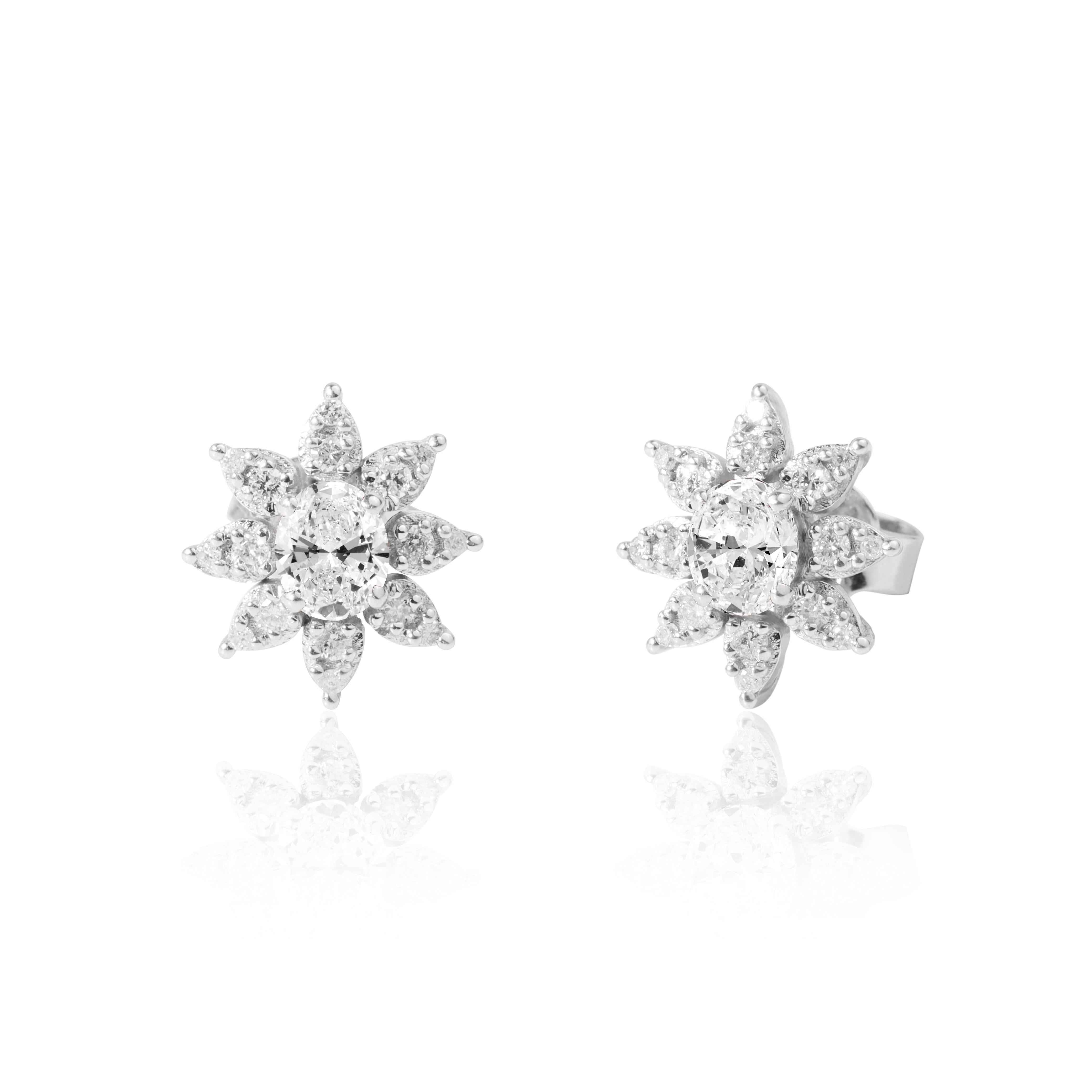 Art Deco GIA Report Certified 0.8 Carats Oval E VS Natural Diamond Halo Stud Earrings For Sale