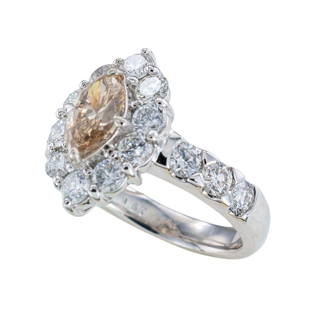 GIA report certified 0.88 carat light brown marquise diamond and platinum engagement ring circa 1990.  It is time to pop the question and present that special lady in your life with this beautiful GIA certified 0.88 carat, light brown marquise