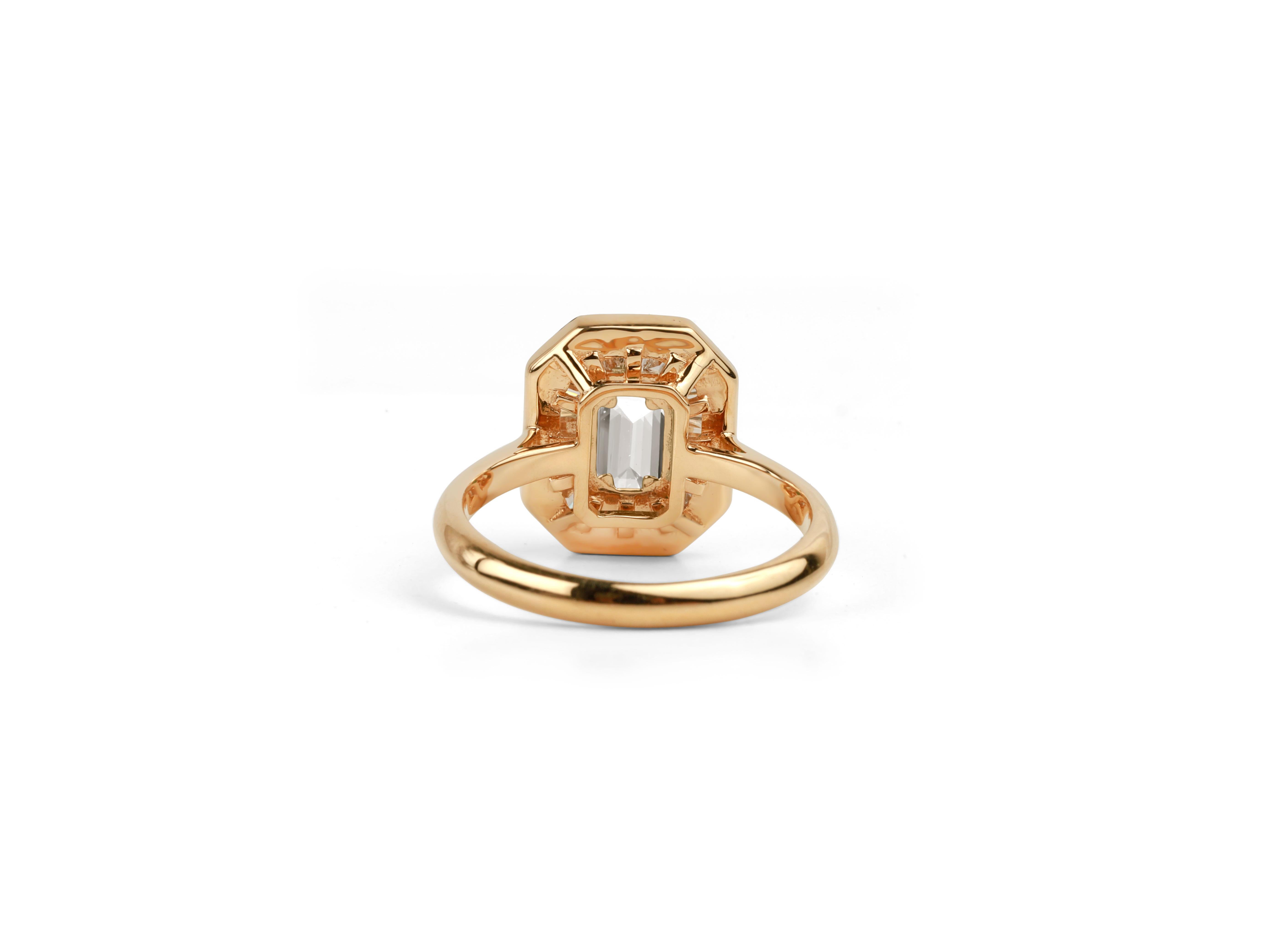 This exquisite 18k solid gold engagement ring features a stunning 1 carat emerald-cut diamond, certified by GIA with an exceptional D color and VVS clarity. The center stone's remarkable clarity and color are further enhanced by a halo of sparkling