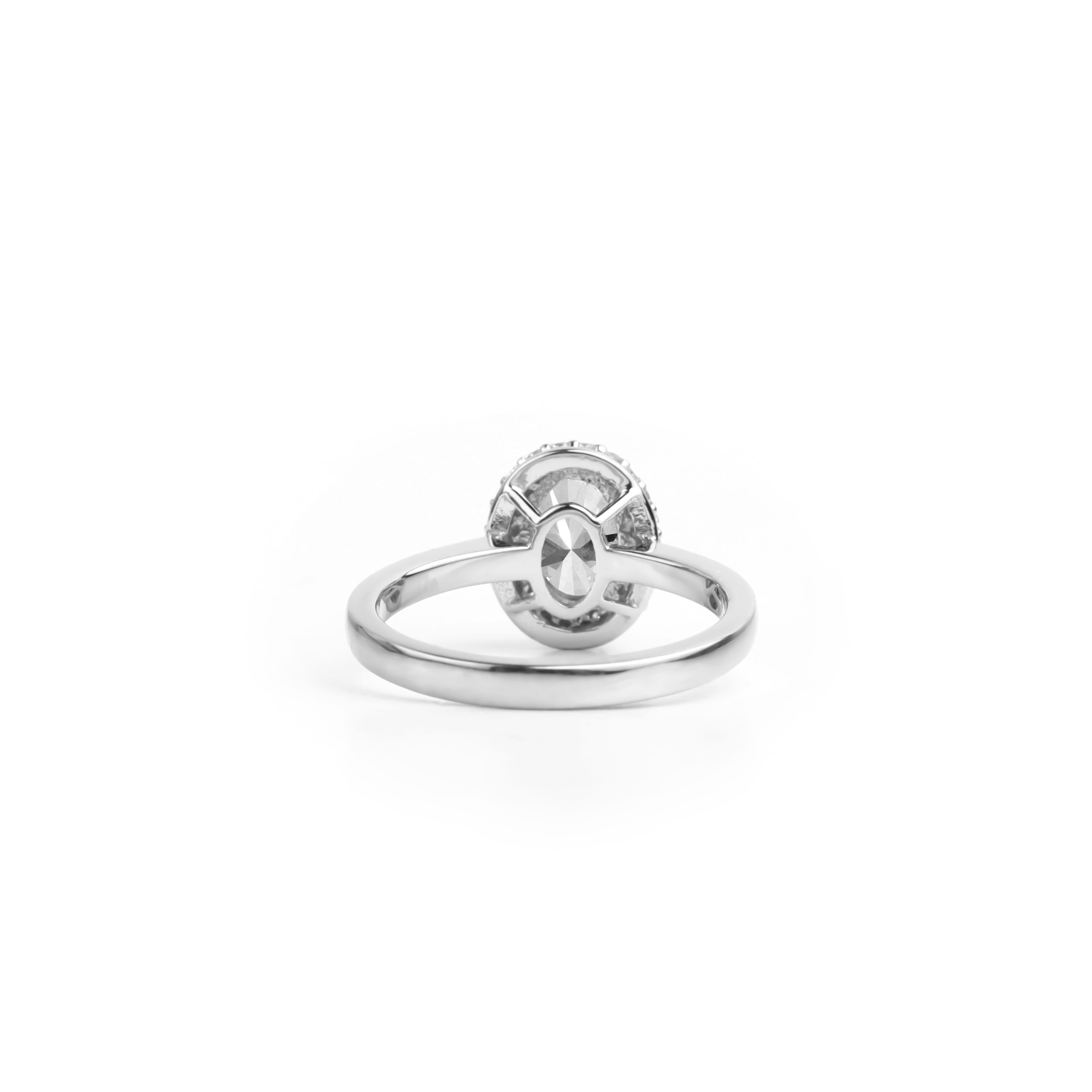 Women's GIA Report Certified 1 Carat E VS Oval Cut Diamond 18k Halo Engagement Ring For Sale