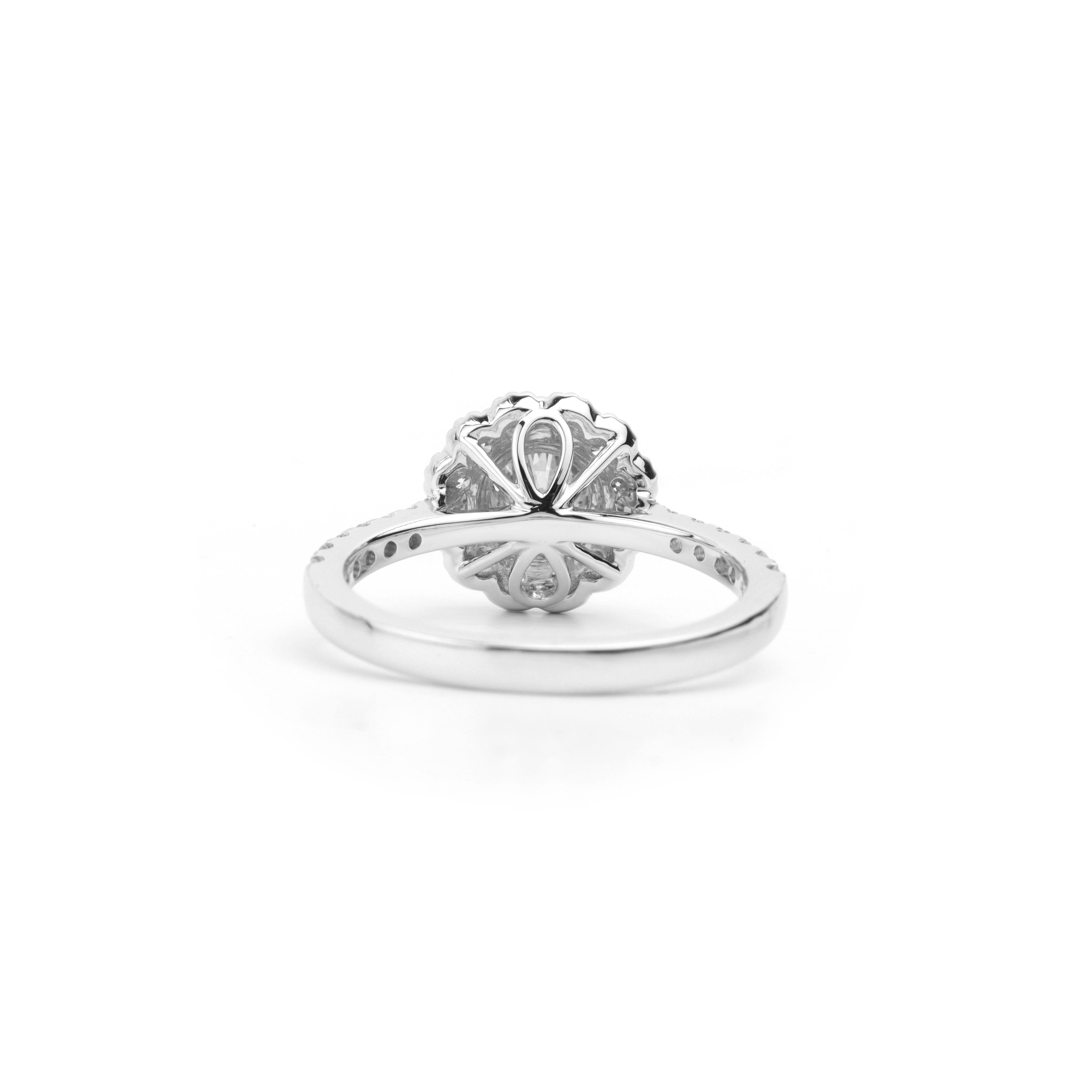 Subtle Spark, Striking Sophistication

A study in precision and poise, this handcrafted ring places a 0.50‑carat natural round‑cut diamond at center stage—GIA certified and prized for its colorless E hue and pristine VS clarity. A fine pavé halo and