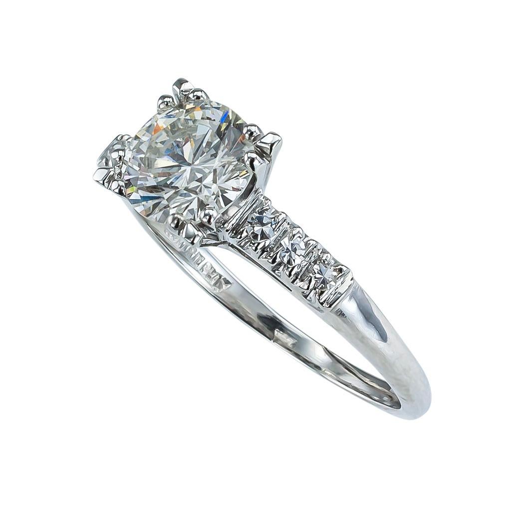 GIA report certified 1.52 carat round brilliant-cut diamond and platinum solitaire engagement ring circa 1950.   Love it because it caught your eye, and we are here to connect you with beautiful and affordable jewelry.  Simple and concise