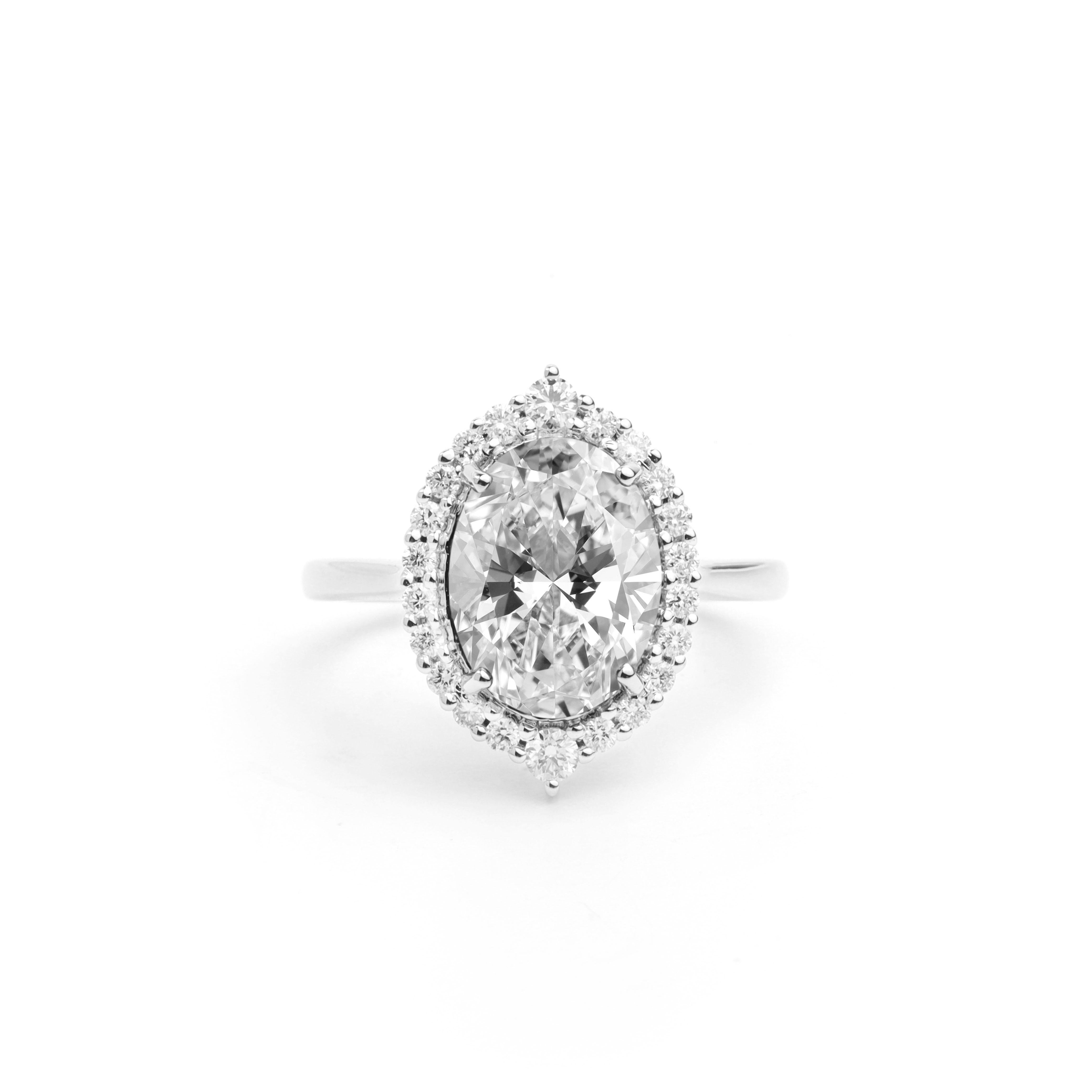 GIA Report Certified 3.5 Carat E VS Oval Cut Diamond 18k Halo Engagement Ring

This timeless piece exudes sophistication and romance, making it the perfect symbol of your love and commitment. With its GIA certification guaranteeing quality and