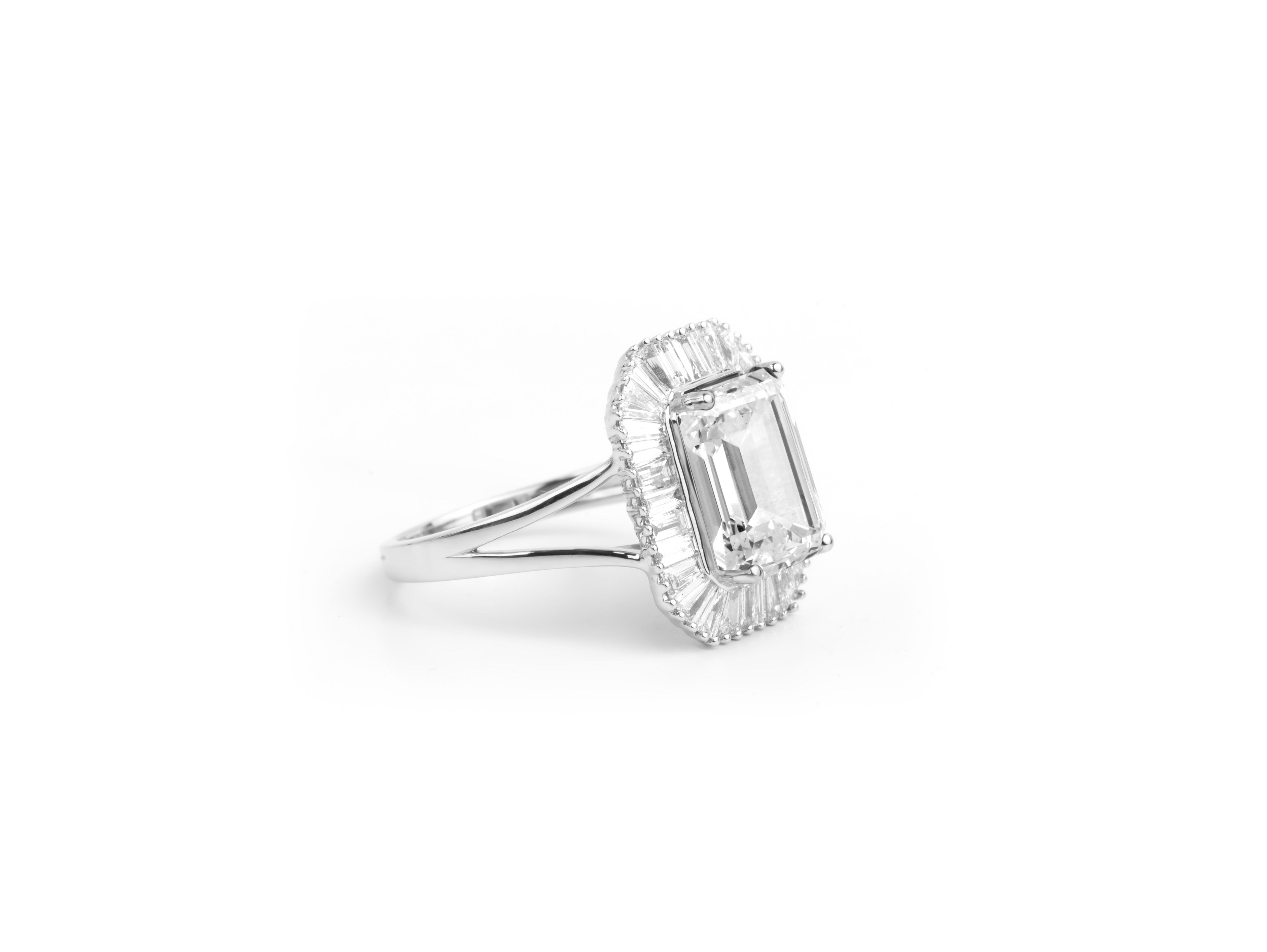 Art Deco GIA Report Certified 4 Carat G VS Emerald Cut Diamond 18k Halo Engagement Ring For Sale