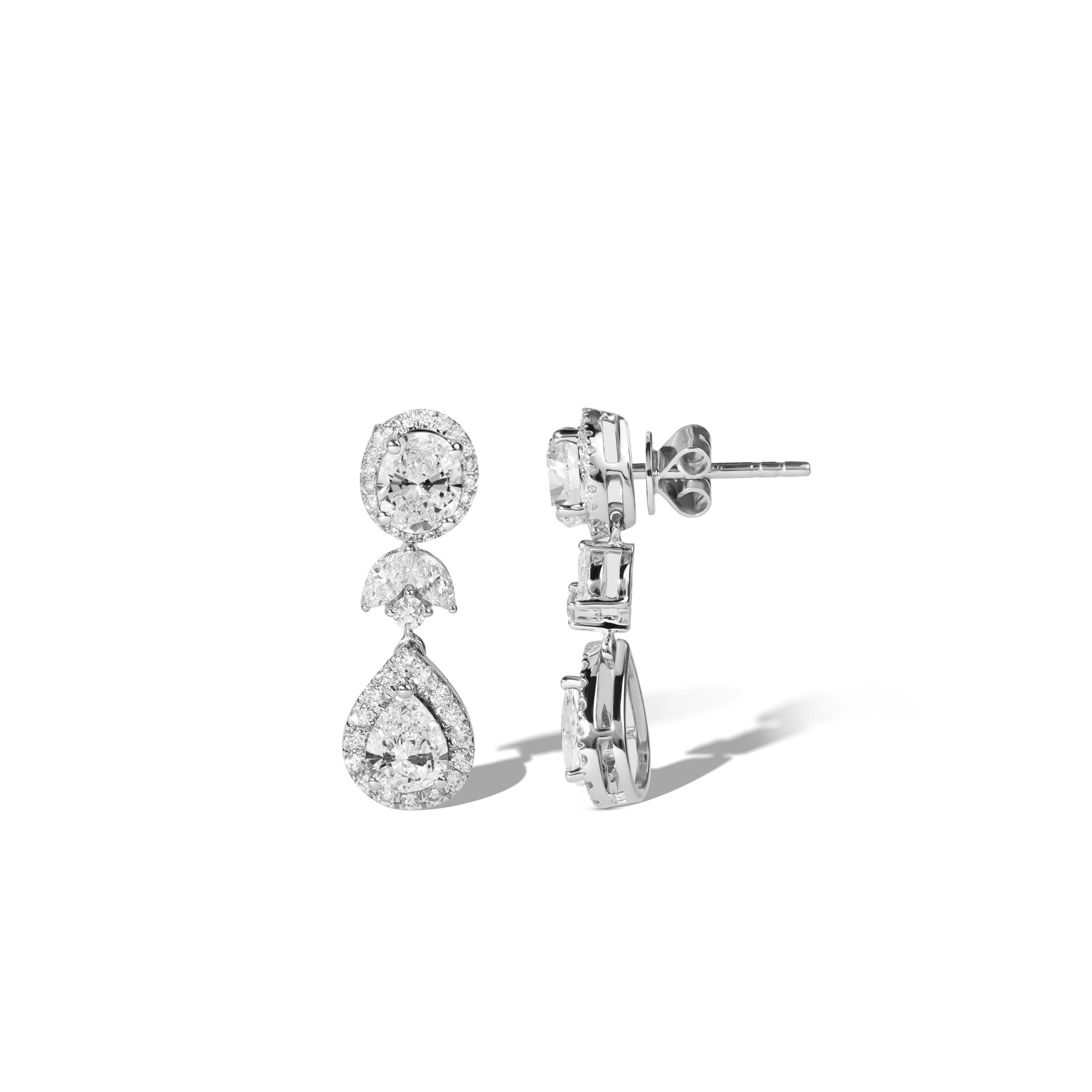 A Symphony of Cut, Clarity & Couture Elegance.

Step into timeless refinement with this radiant pair of halo dangle earrings, featuring a harmonious blend of natural pear and oval-cut diamonds, each meticulously selected for their 0.8ct size, VVS