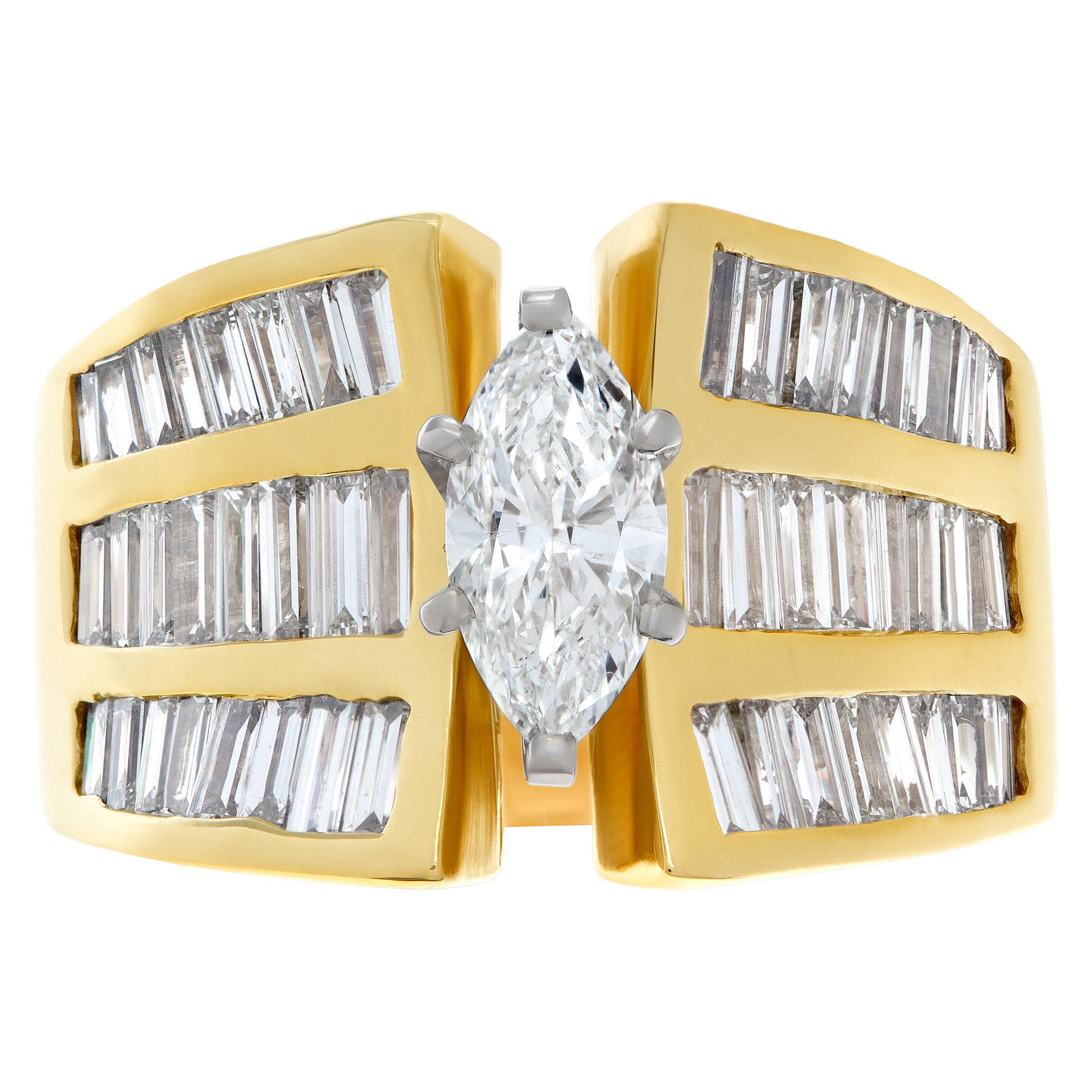 GIA report certified marquise diamond 0.93 carat (G color, SI1 clarity) ring set in a 18k yellow gold setting with app 2.50 carat baguette diamond; size 8.5 This GIA report certified ring is currently size 8.5 and some items can be sized up or down,