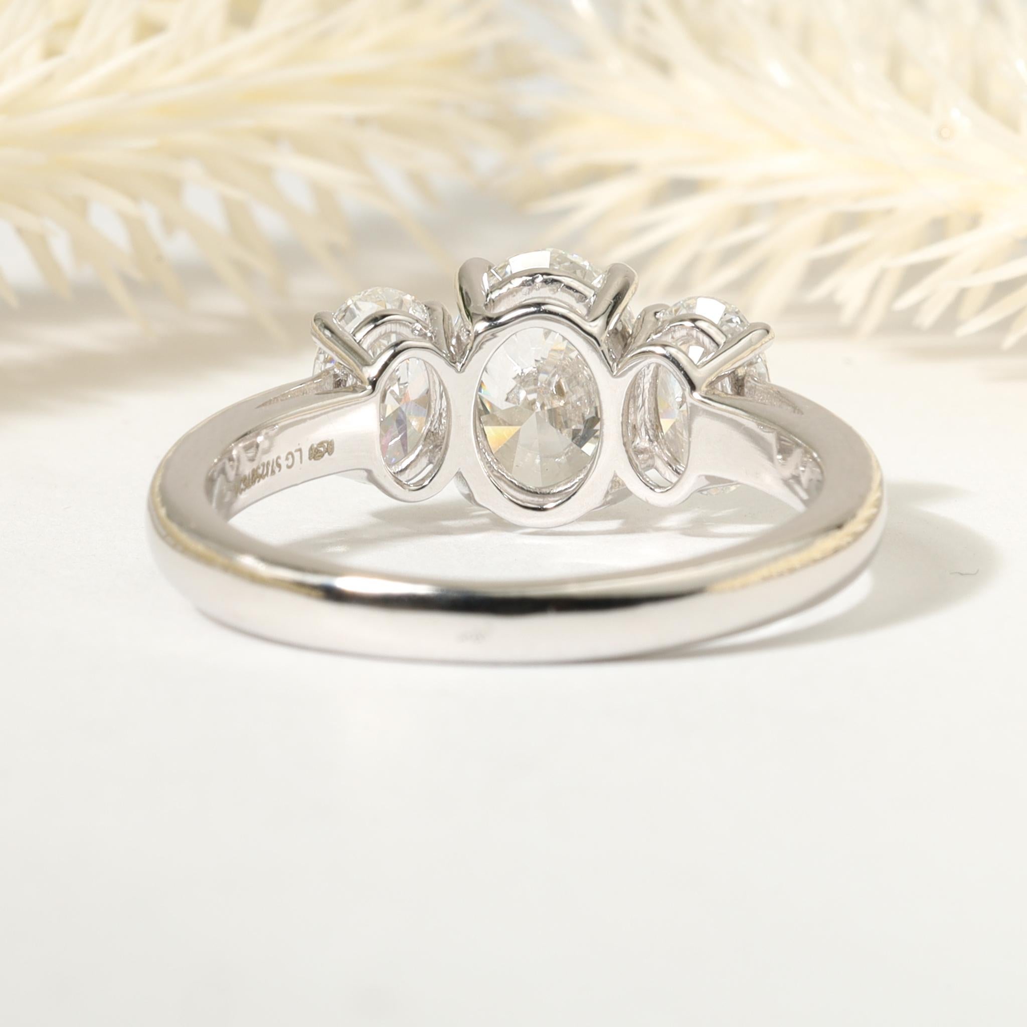 Heart Cut GIA Report Certified Oval Cut E VS 3 Stone 1.7 Carat  Diamond Ring 18k White For Sale