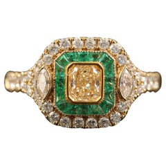 GIA Report Certified Yellow Diamond Emerald and Diamond Yellow Gold Cluster Ring