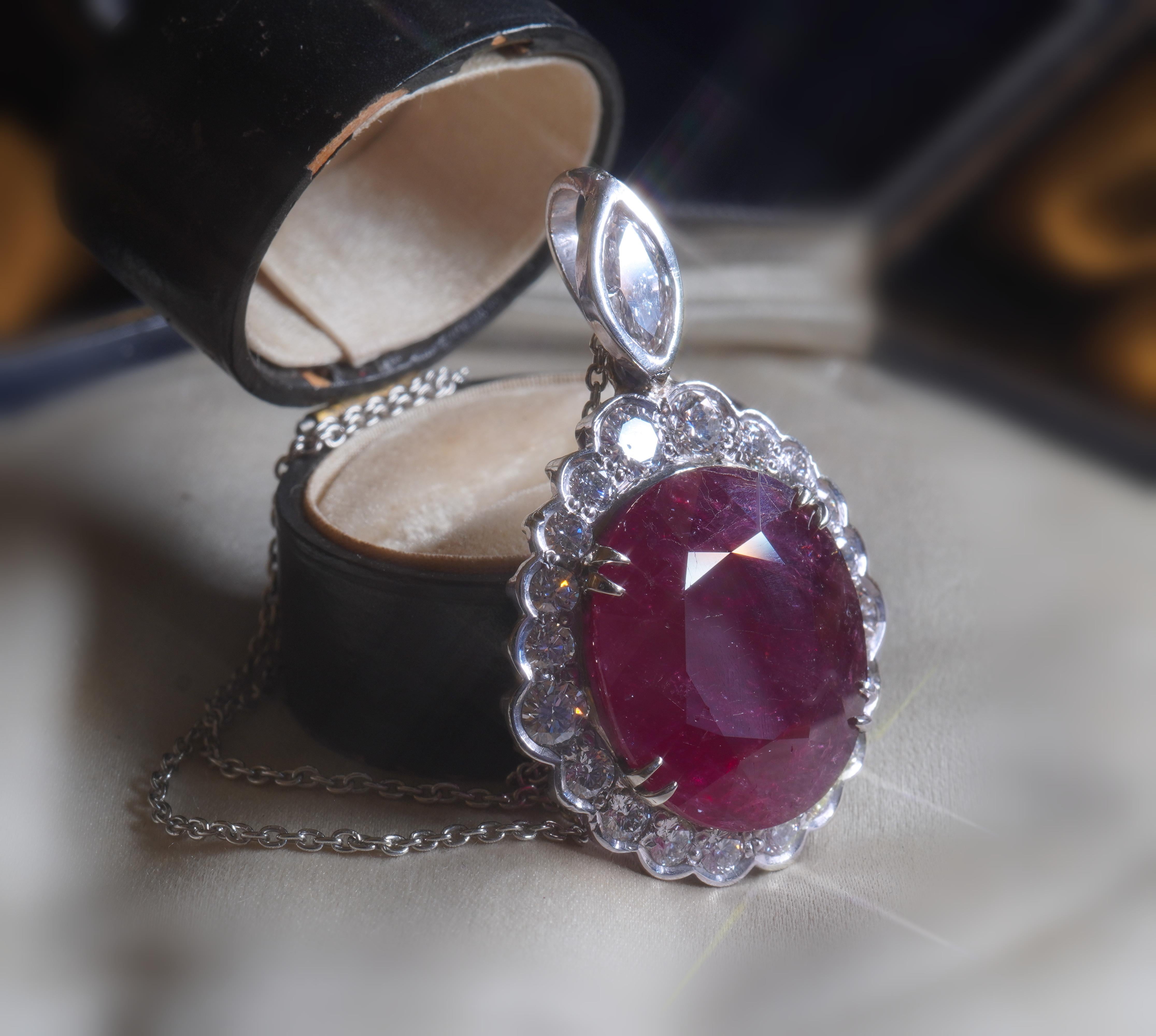Old South Jewels proudly presents....LUXURY.   GIA ANTIQUE PLATINUM NO HEAT RUBY

DIAMOND 22.74 CARAT VINTAGE PENDANT!  Giant 18.42 Carat Rich Red Ruby!

Crowned With 4.32 Carats of Sparkling Diamonds White Eye Clean Big Diamonds.  Beautiful .50