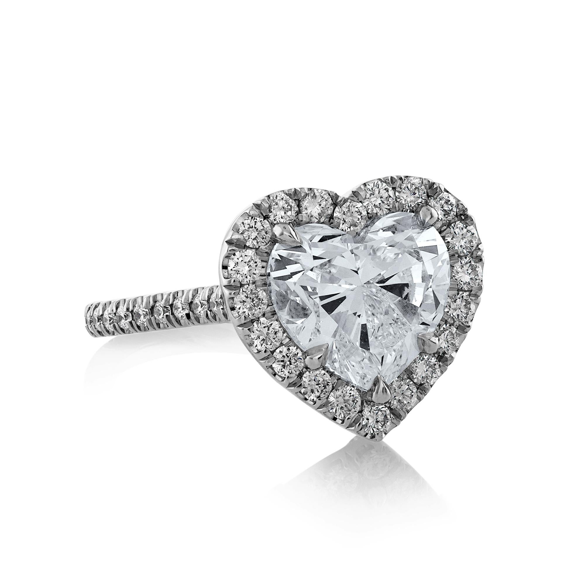 There is nothing more ROMANTIC than this exquisite 3.91ctw Heart Shaped Diamond Platinum Engagement Ring!
An icy-white, sleekly modeled HEART diamond is the center of attention. This century-old shape diamond, symbolizing love and devotion, weighing