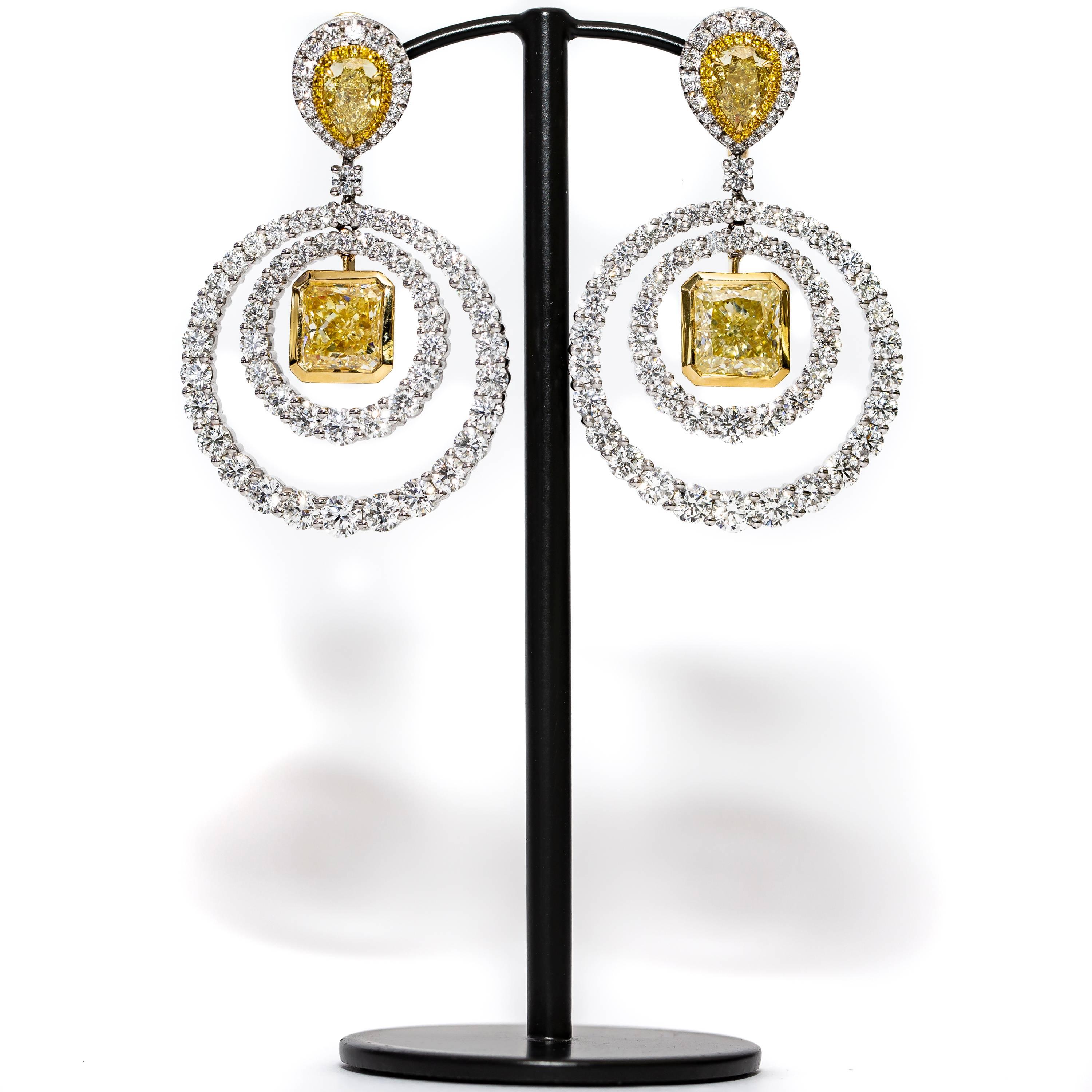 These Unique GIA Certified 19.38 Carat drop circle of life Earrings featuring 2 Square Cut - Cornered Rectangular Modified Brilliant GIA Certified Diamonds Y to Z in color with VS1 to VVS2 clarity totaling 8.02 Carat which are situated in the center