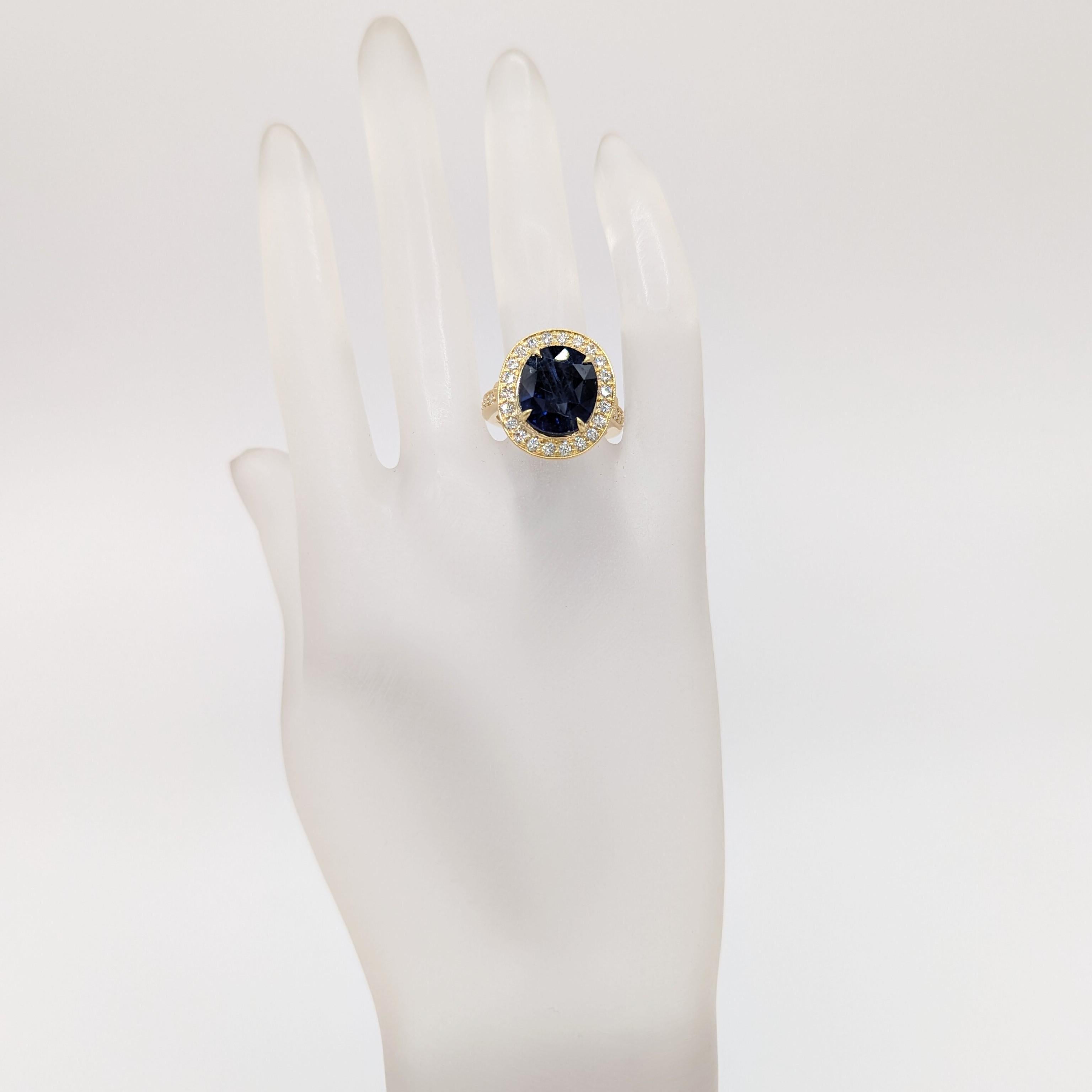GIA 9.45 ct. Sri Lanka blue sapphire oval with good quality white diamond rounds.  Handmade in 18k yellow gold.  Ring size 7.  GIA certificate included.