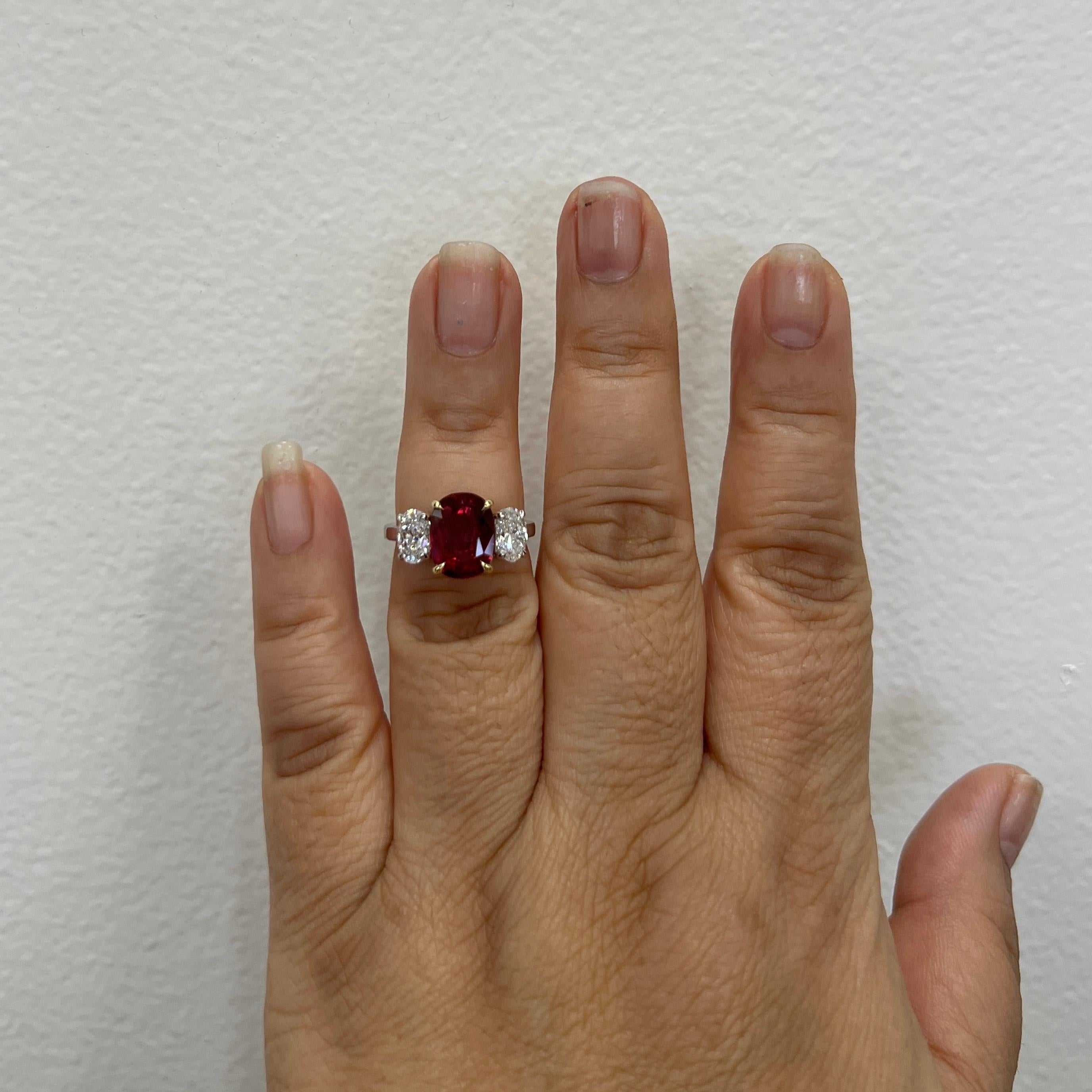 Gorgeous GIA 3.14 ct. Thai ruby oval with 1.41 ct. D-E VS-SI white diamond ovals (each stone weighs 0.70 ct.).  Handmade in platinum and 18k yellow gold.  Ring size 6.5.  GIA certificate included.

