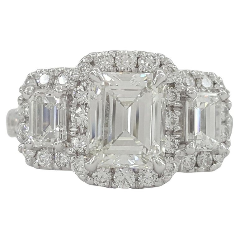 Three Stone 14k White Gold Emerald Cut Diamond Engagement Halo Ring.




