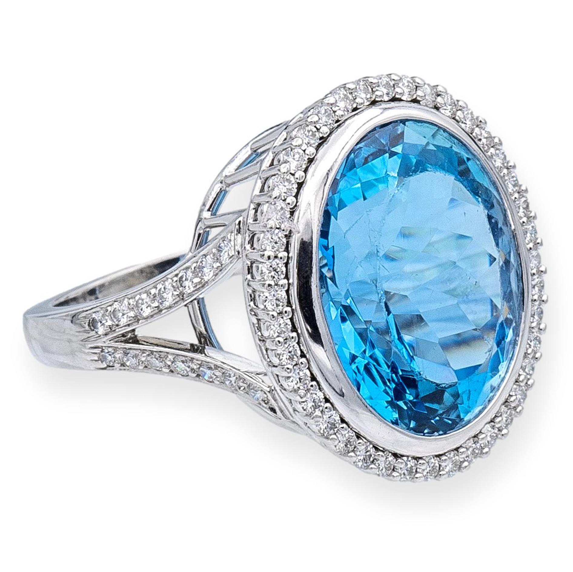 This Tiffany & Co. cocktail ring finely crafted in platinum is a true masterpiece of fine craftsmanship made of exquisite platinum. The centerpiece of the ring is a magnificent oval aquamarine, set inside a bezel weighing an impressive 10.66 carats