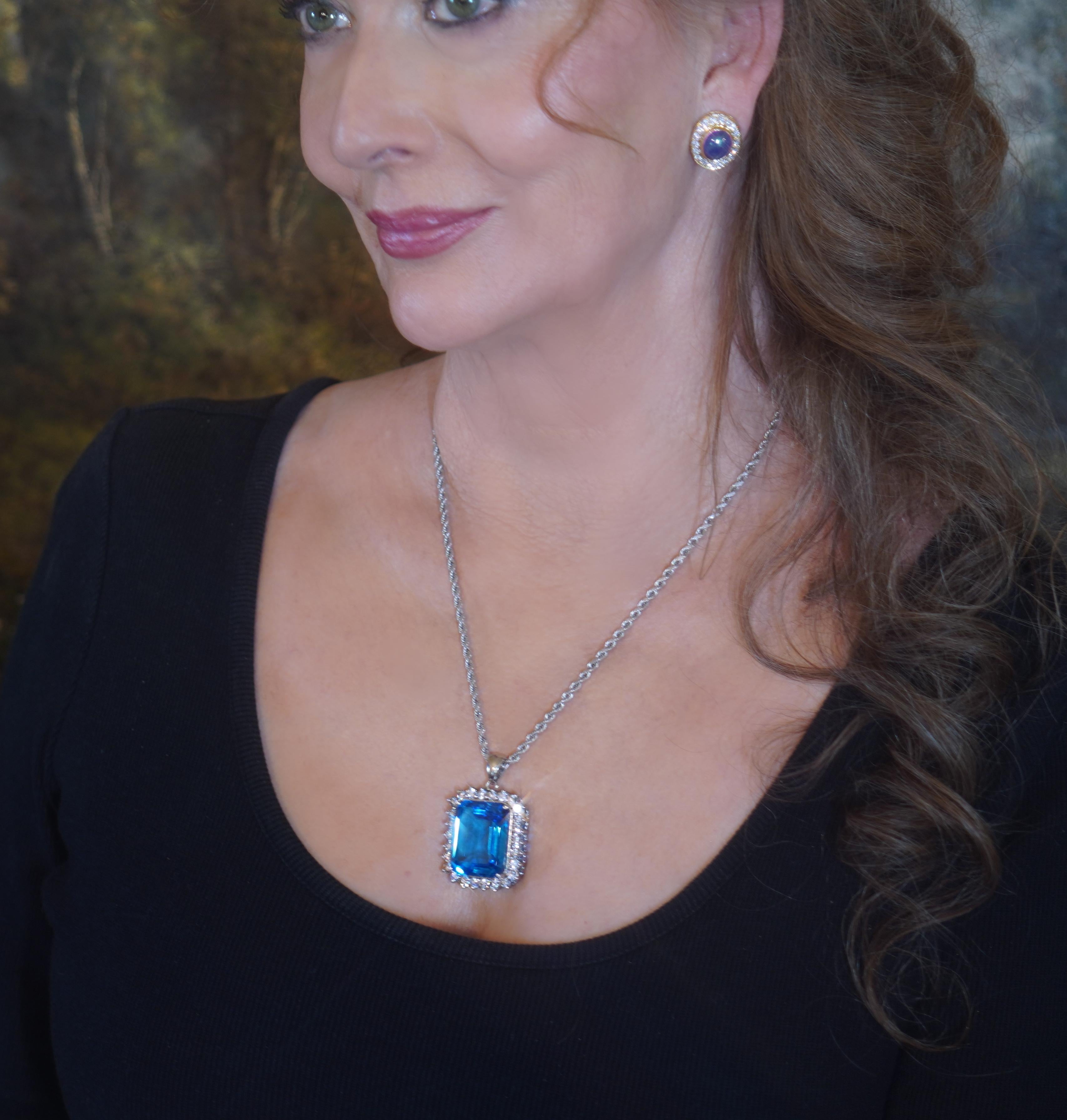 Old South Jewels proudly presents...LUXURY.   FINE GIA CERTIFIED 62.27 CARAT GORGEOUS BLUE TOPAZ & DIAMOND VINTAGE PENDANT!   BREATHTAKING 56.75 CARAT FINE EMERALD CUT TOPAZ IS CROWNED WITH 5.52 CARATS OF SPARKLING WHITE FINE BIG DIAMONDS. 