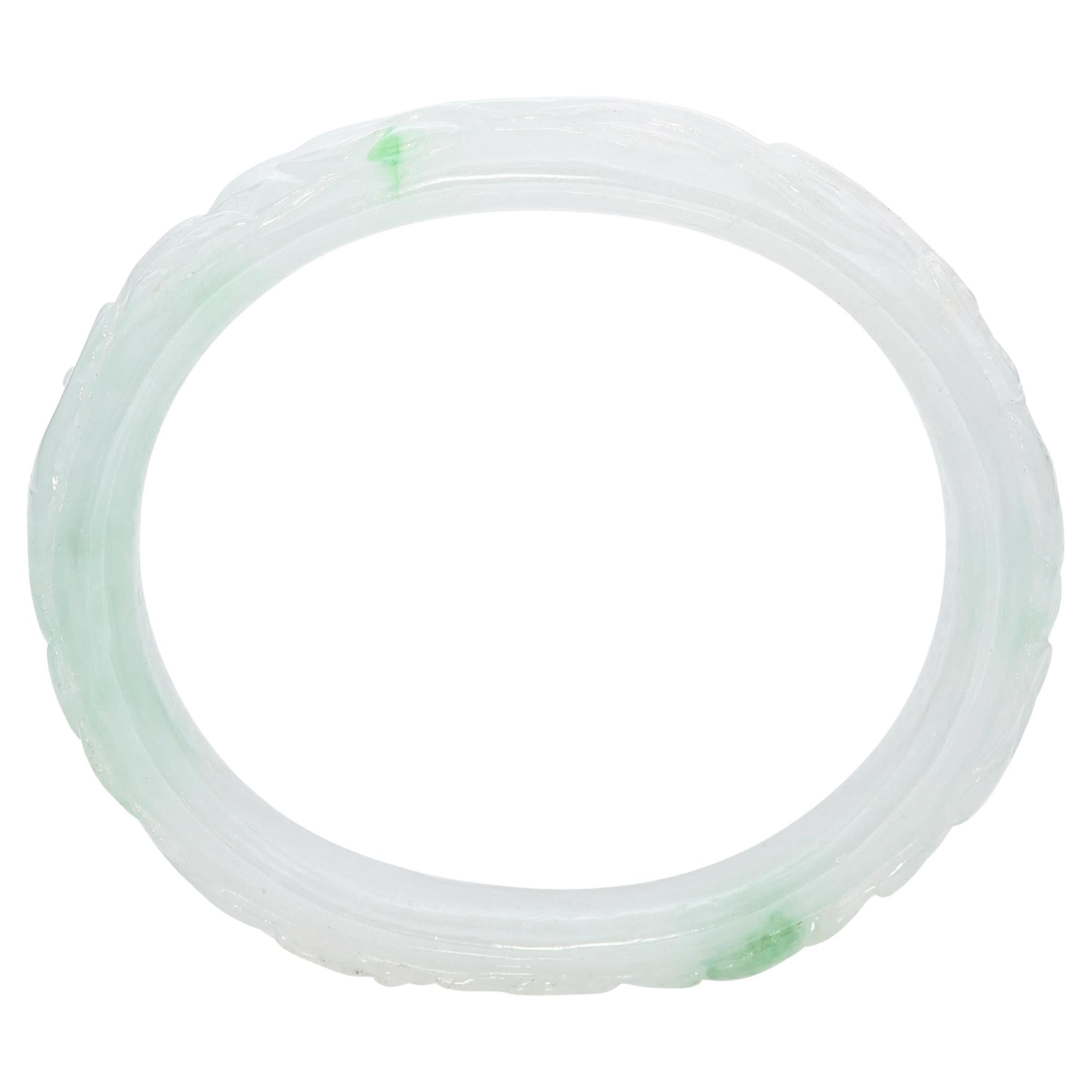 GIA Translucent Variegated Light Gray 
Green Carved Jadeite Bangle Bracelet For Sale