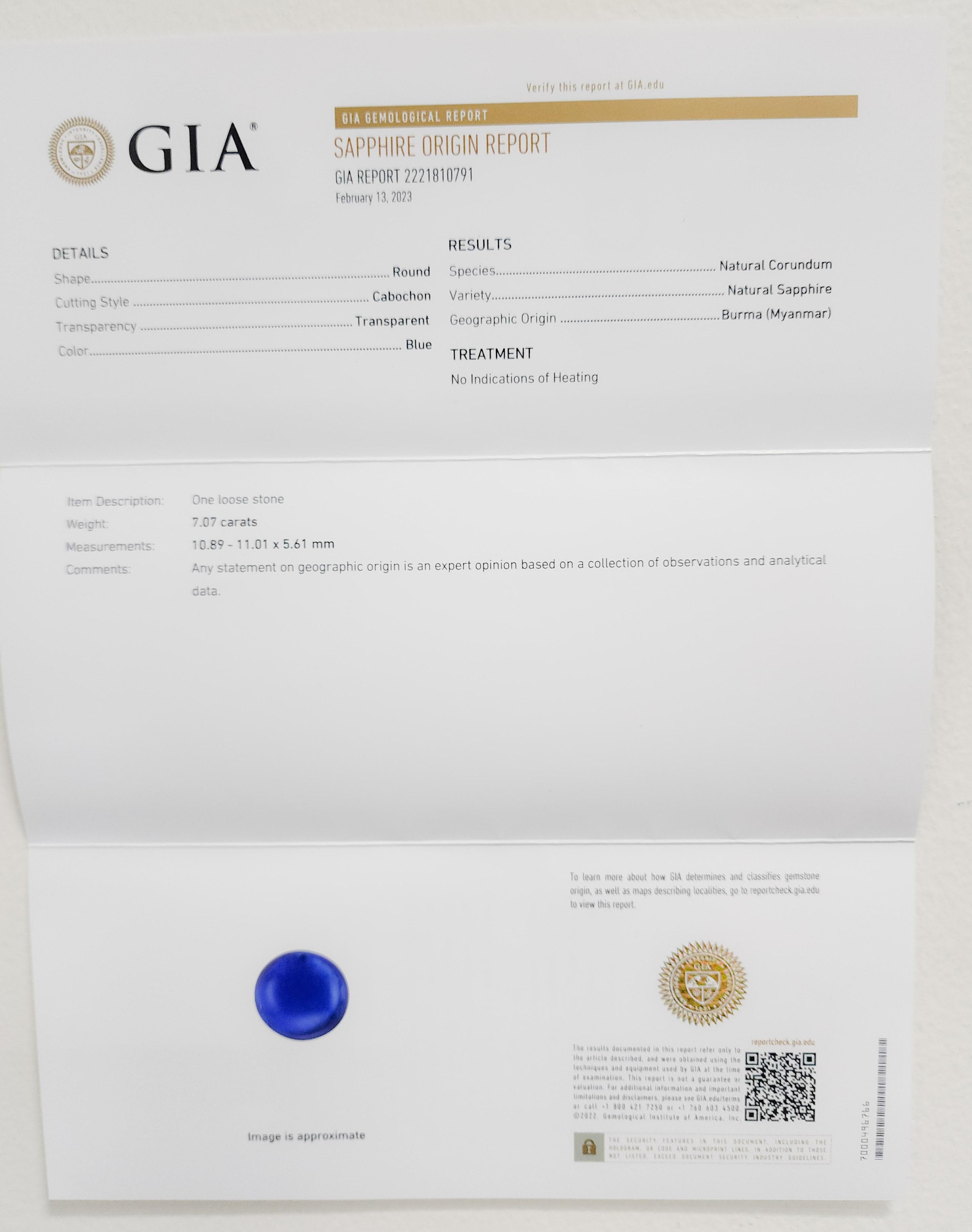 Beautiful 7.07 ct. Burma blue sapphire cabochon round with 0.52 ct. good quality white diamond rounds.  Handmade in 18k white gold.  Ring size 6.5.  GIA certificate included.