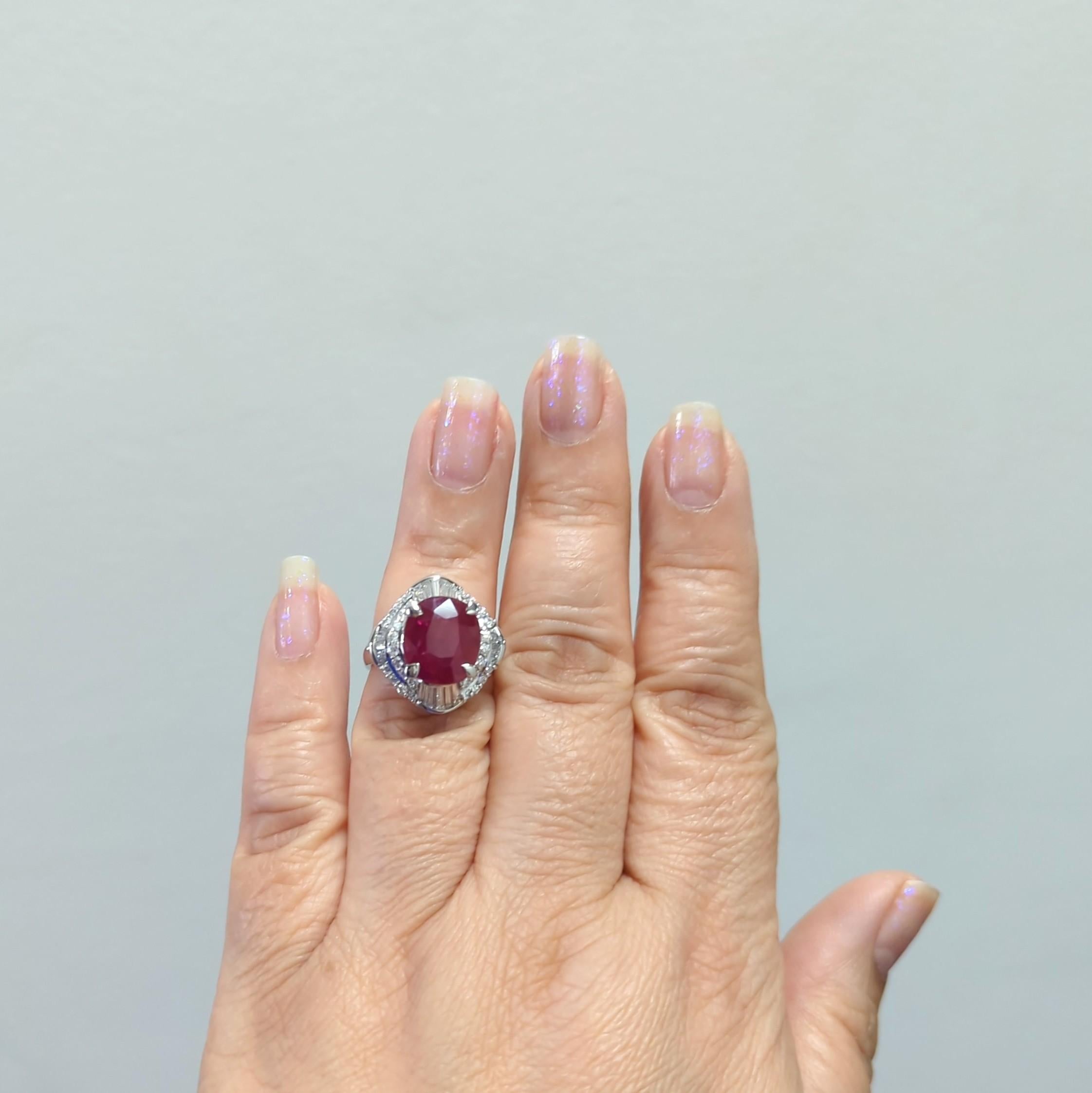 Gorgeous deep red unheated 5.20 ct. Mozambique ruby oval with 1.37 ct. good quality, white, and bright diamond baguettes and rounds.  Handmade in platinum.  Ring size 6+.  GIA certificate included.