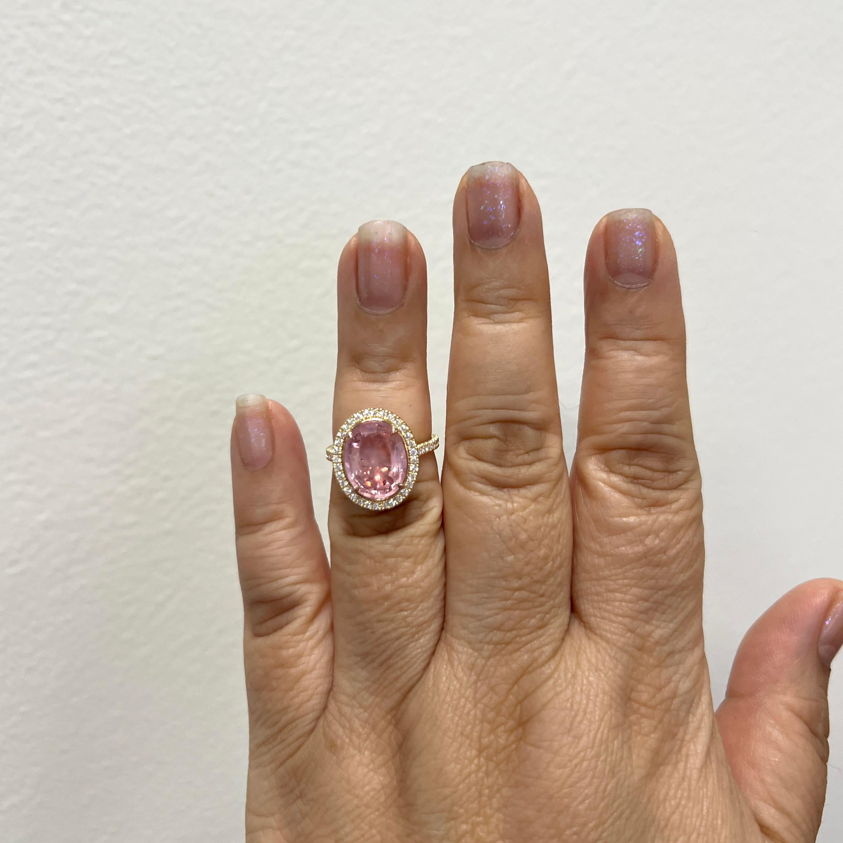 Stunning 5.73 ct. unheated orange pink padparadscha sapphire oval with 0.59 ct. white diamond rounds.  Handmade in 18k yellow gold.  Ring size 6.5.  Comes with GIA certificate.