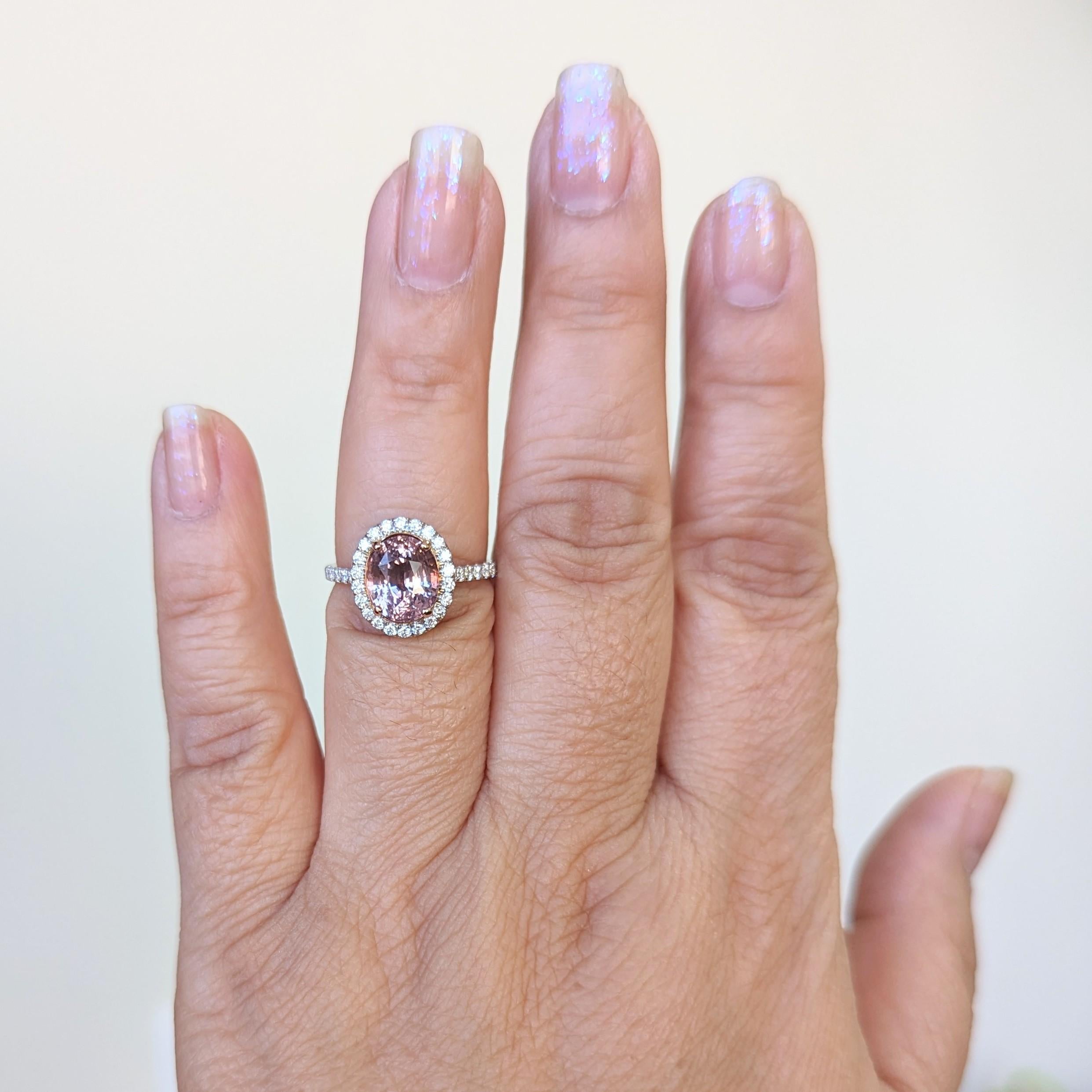 Gorgeous GIA unheated 3.55 ct. pink sapphire oval with good quality white diamond rounds.  Handmade in 18k yellow gold and platinum.  Ring size 6.5.  GIA certificate is included.