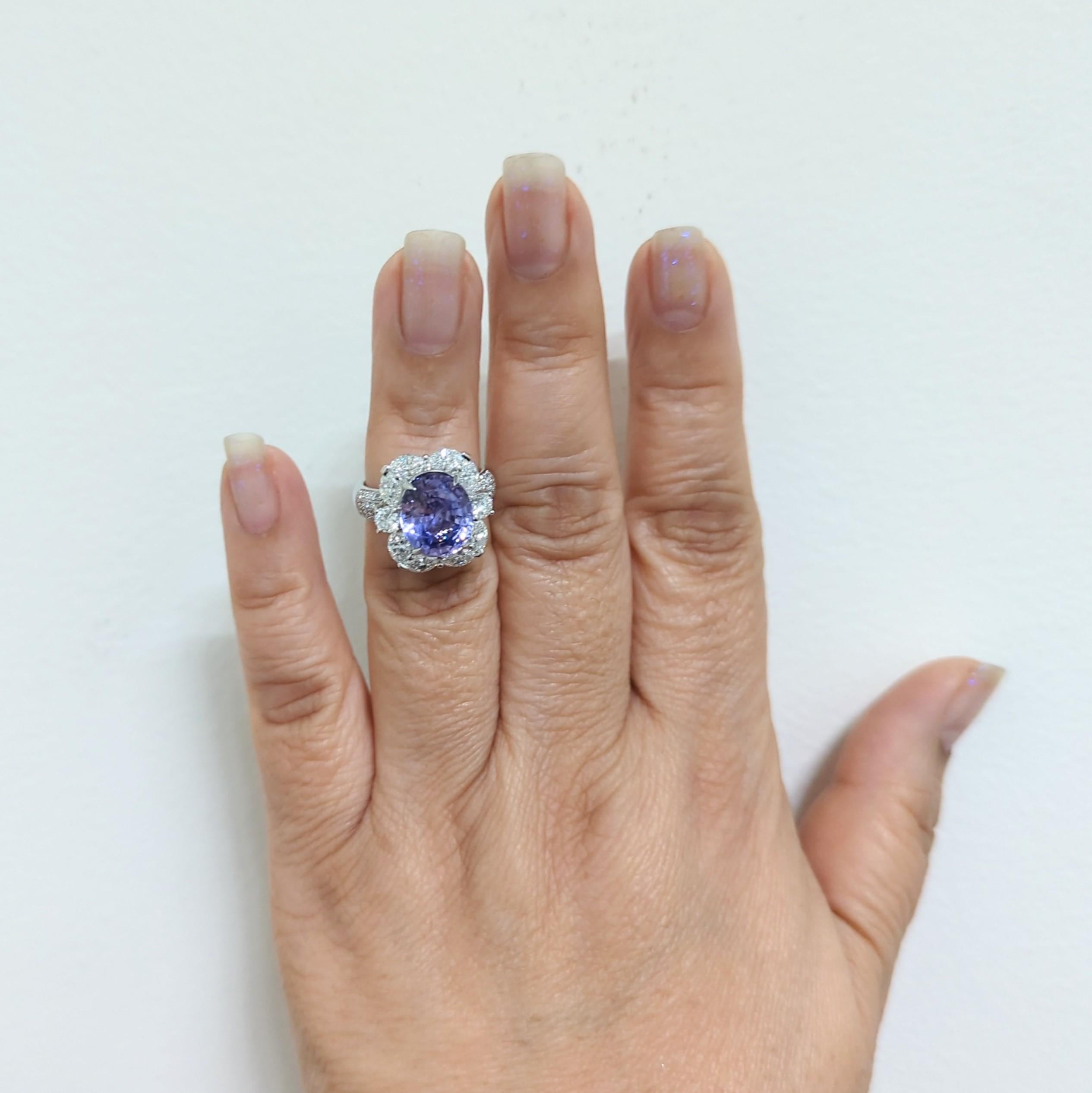 Gorgeous GIA unheated 6.68 ct. purple sapphire oval with good quality white diamond marquises and rounds.  Handmade in 18k white gold.  Ring size 6.25.  GIA certificate included.