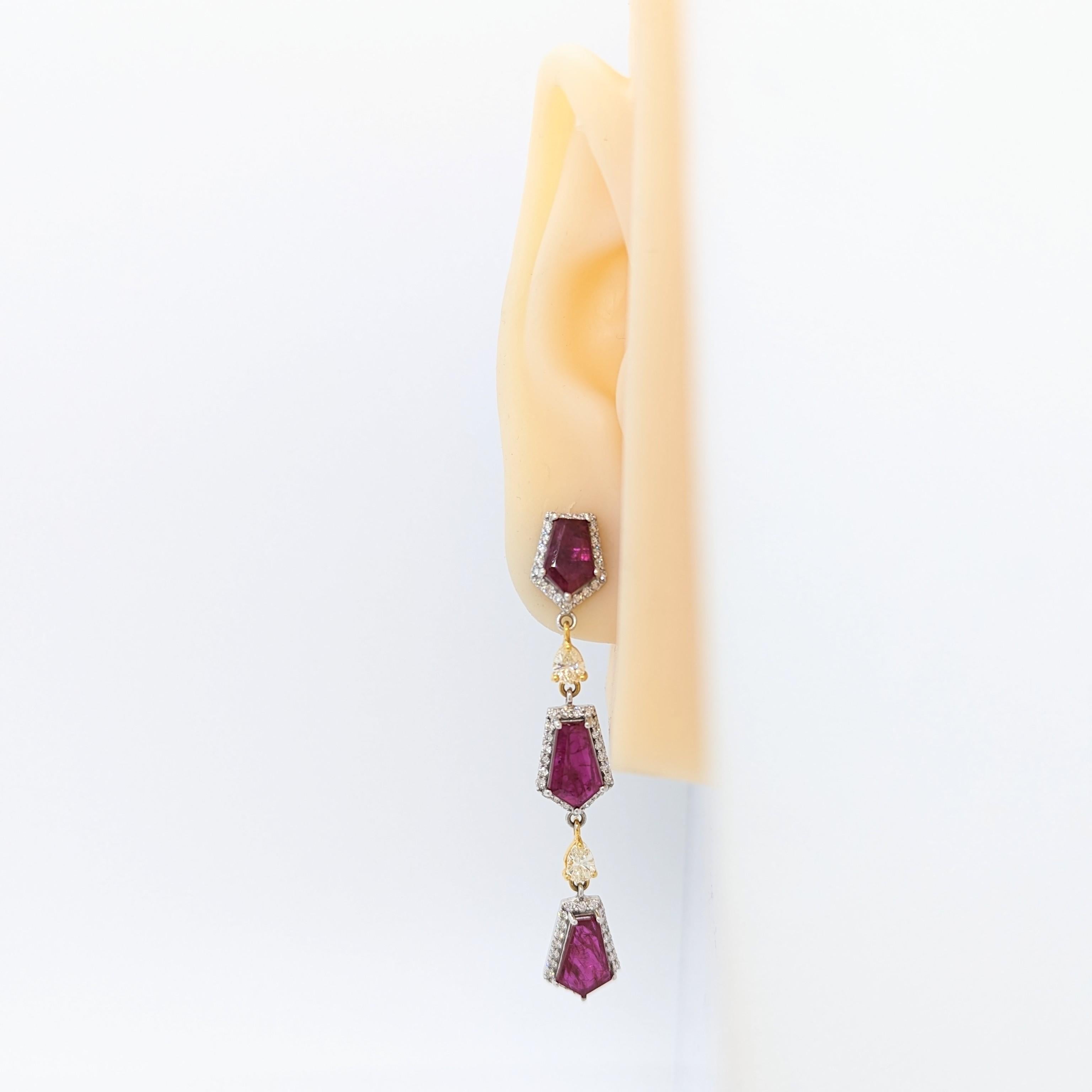 Stunning dangle earrings with GIA certified unheated 8.40 ct. purplish red ruby kit shapes with 2.00 ct. good quality, white, and bright diamond rounds.  Handmade in 18k white and yellow gold.  GIA certificate included.