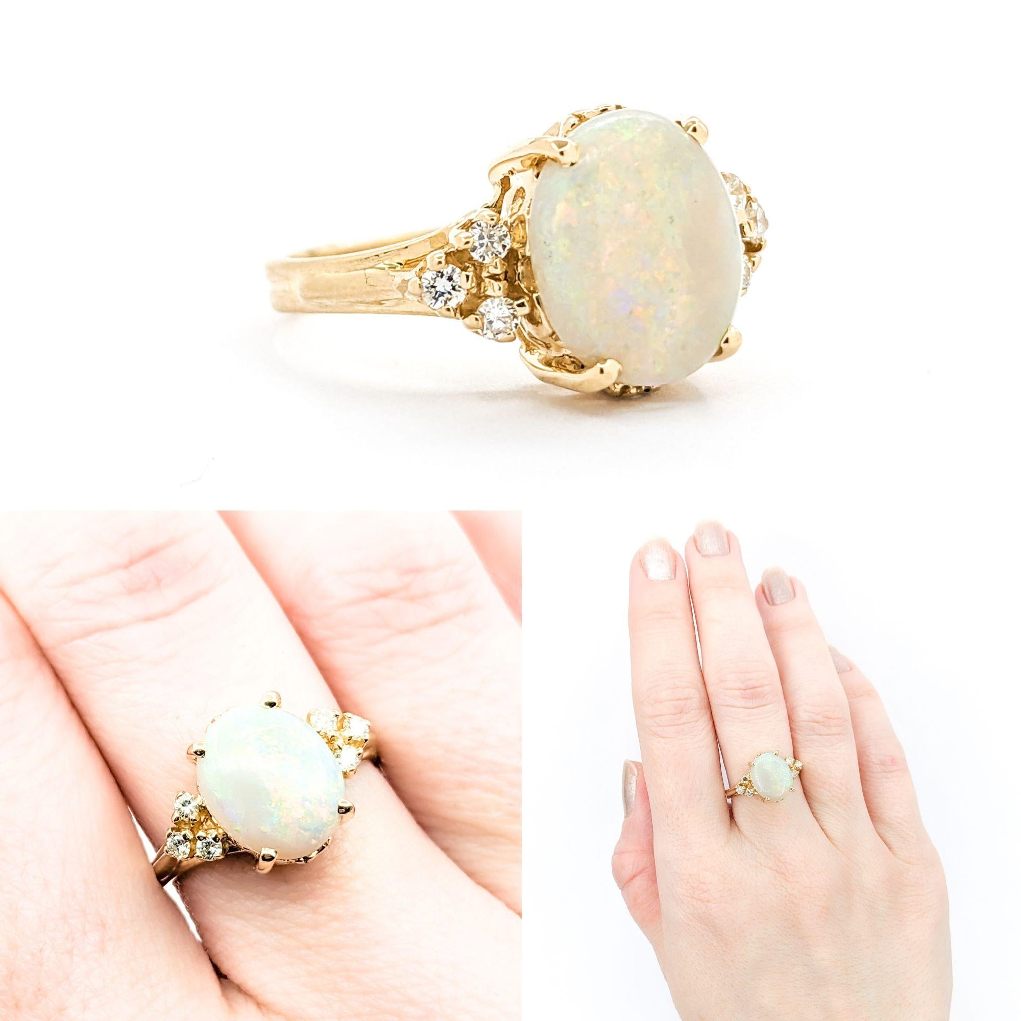 GIA Vintage Australian Opal & Diamond Ring in Yellow Gold

Introducing this beautiful Australian Opal Ring crafted in 14k Yellow Gold. The ring features a 2.27ct Australian Opal Centerpiece with .16ctw Round Diamonds in the form of glittering