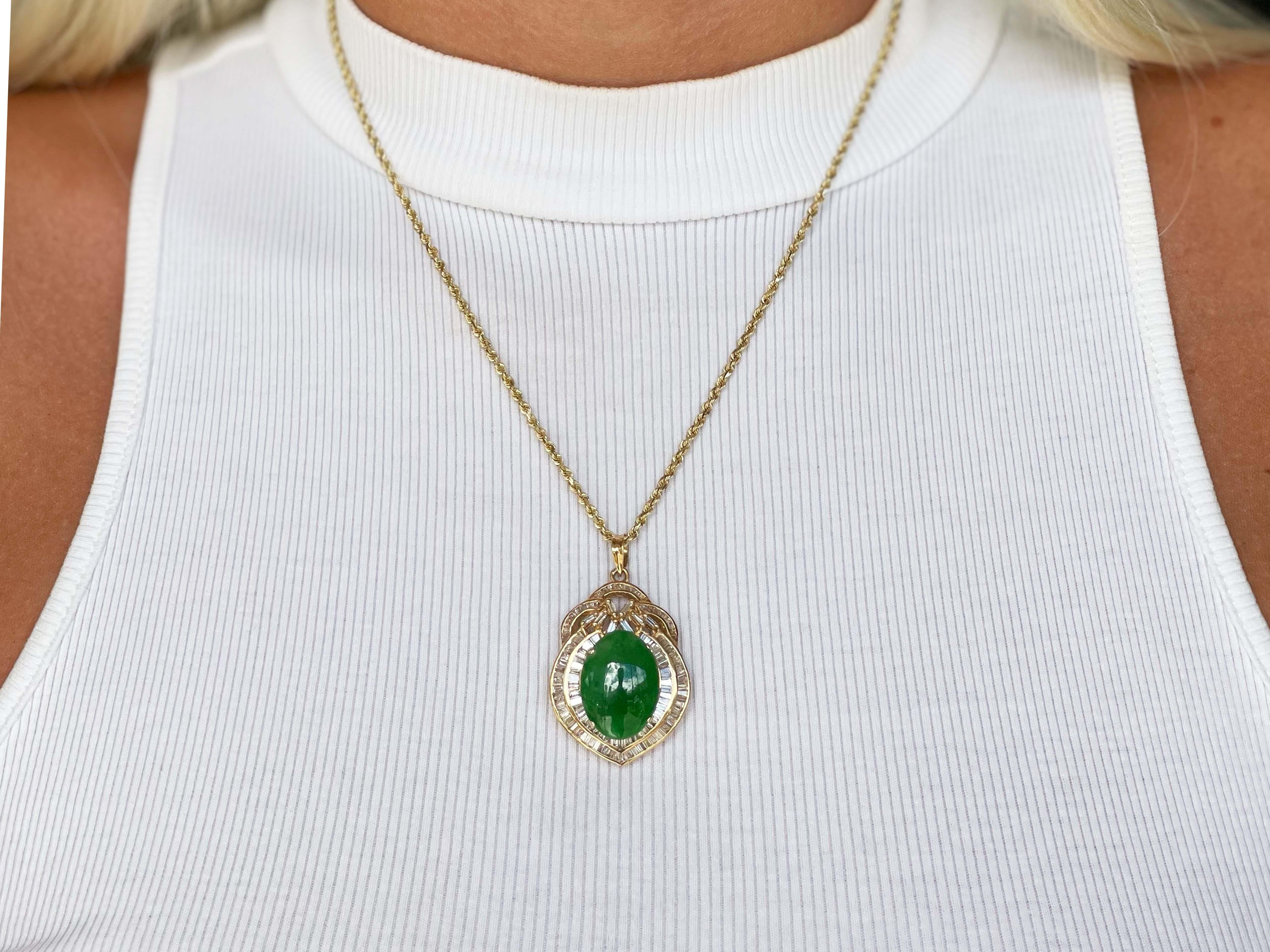 GIA Vintage Cabochon Mottled Green Translucent Jadeite Jade and Diamond Pendant in 18k Yellow Gold. This stunning pendant is set with a gorgeous oval shape cabochon mottled green jadeite jade with a double baguette diamond halo. The center Jadeite