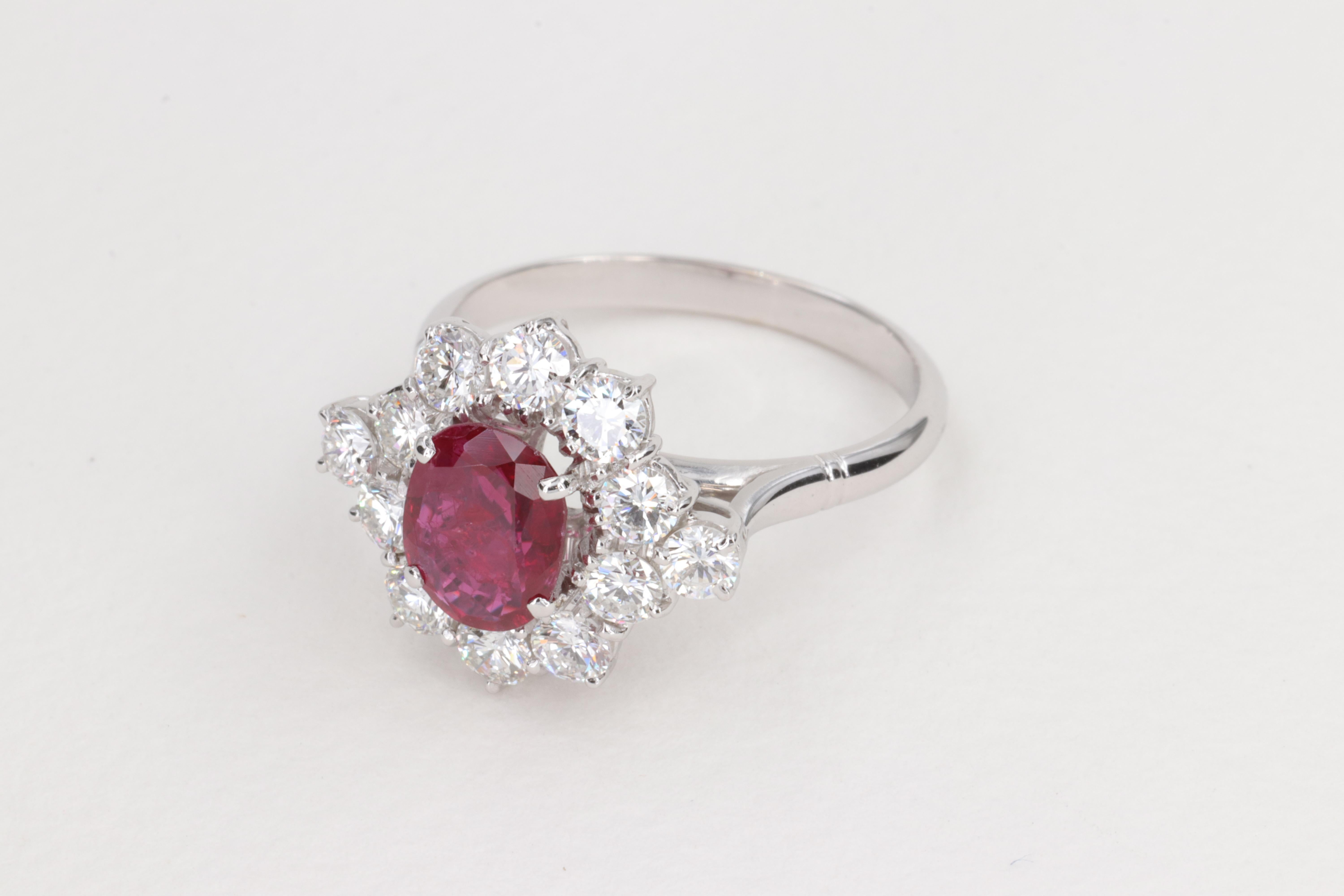Oval Cut G.I.A. Vivid Red Ruby and Diamond Halo Handmade Ring For Sale