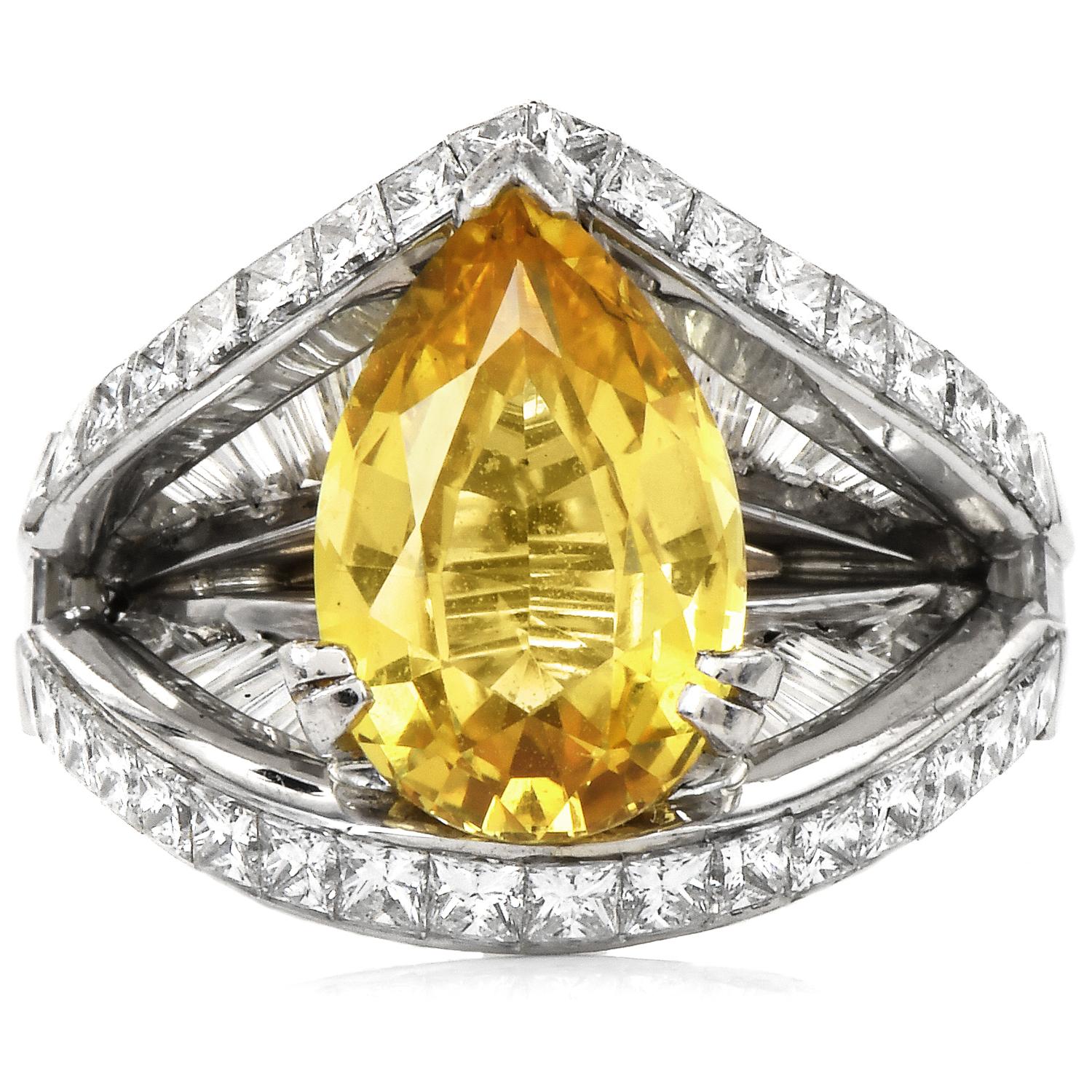 This exquisite GIA Certified 4.96cts Vivid Yellow Sapphire Ring has a No Heat Sapphire in the center.

Adorned in the sides by a mirror-like open design, with many genuine Diamonds.

Crafted in solid Platinum.

(12) baguettes, channel set on the