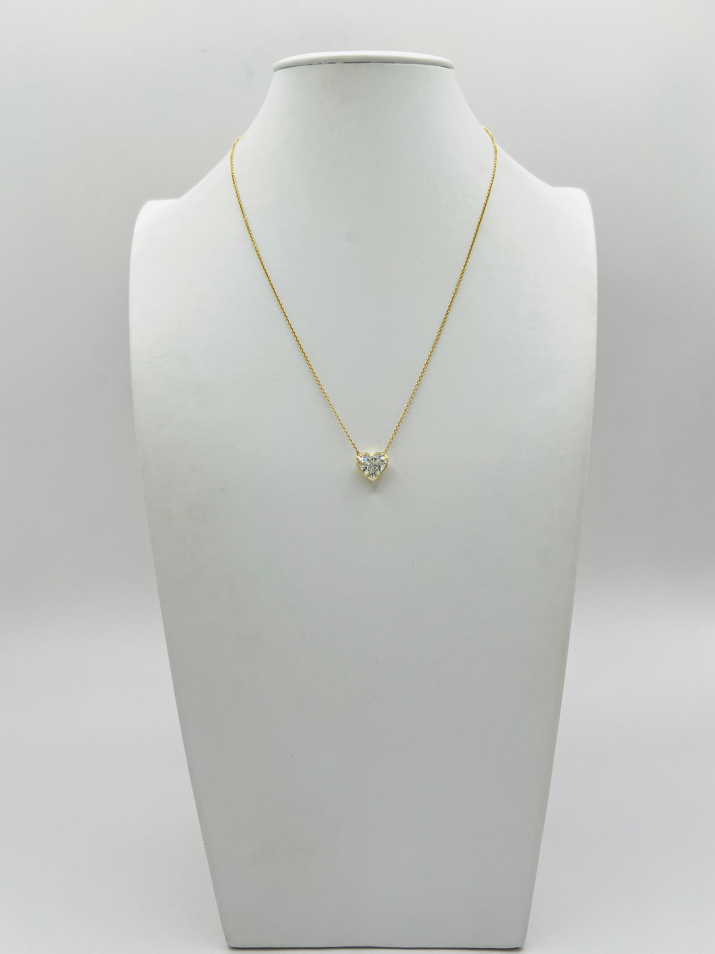 Gorgeous 3.01 ct. I SI1 white diamond heart shape.  Handmade in 18k yellow gold.  Length of chain is 18