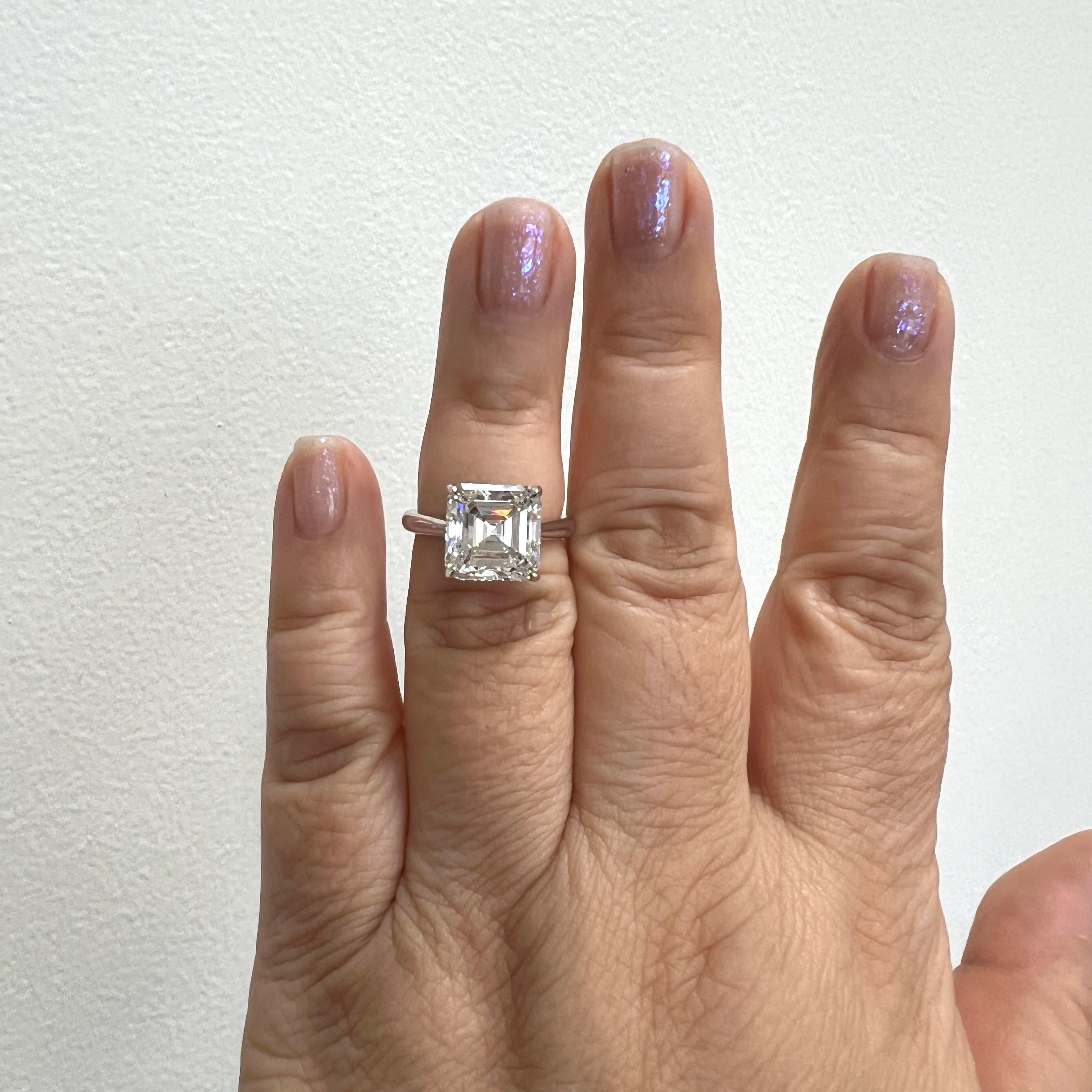 Absolutely stunning 6.10 ct. J VS1 white diamond asscher cut.  Handmade in platinum.  Ring size 6.25.  Comes with a GIA certificate.