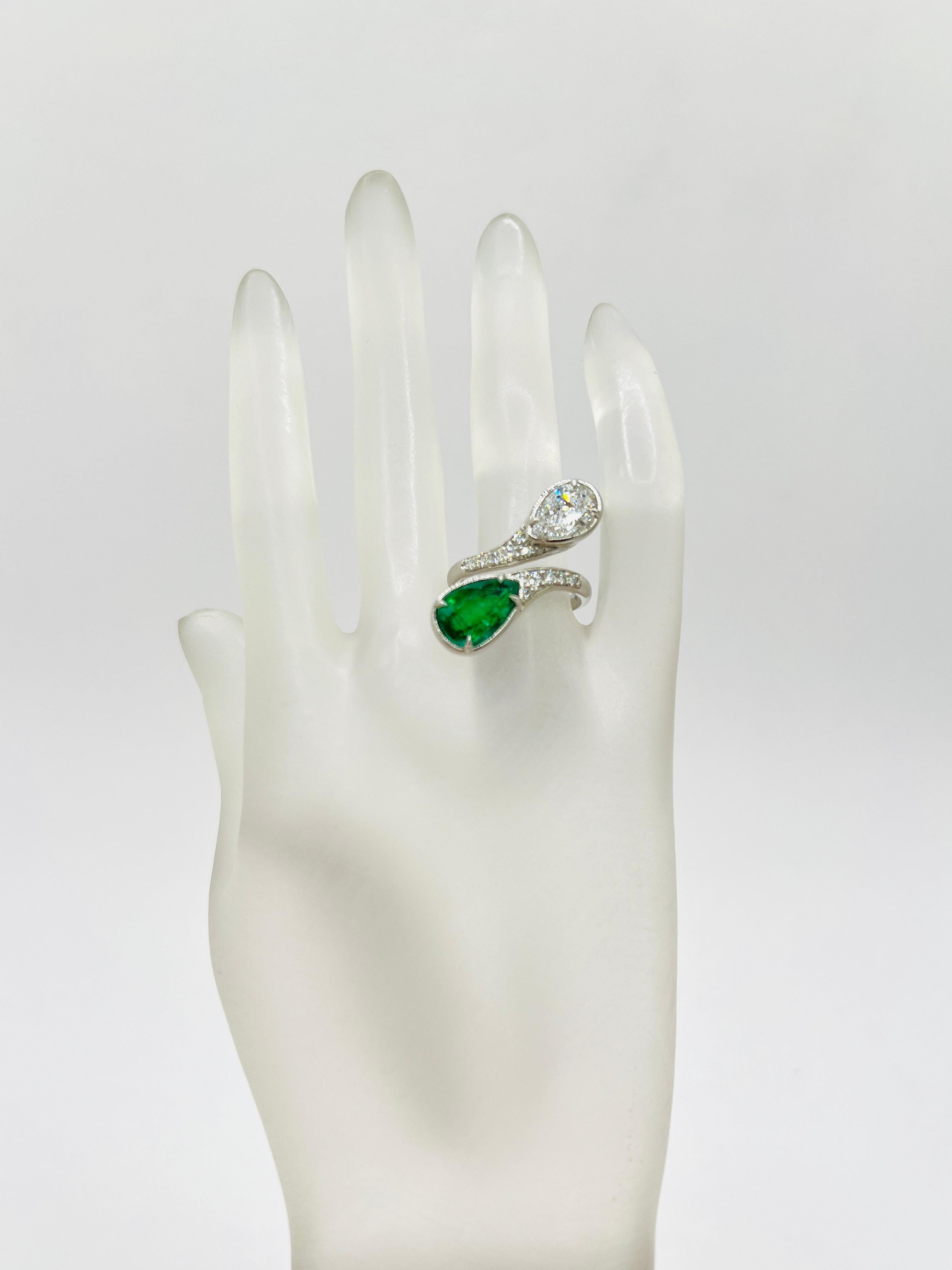 Pear Cut GIA White Diamond and Emerald Bypass Ring in Platinum For Sale